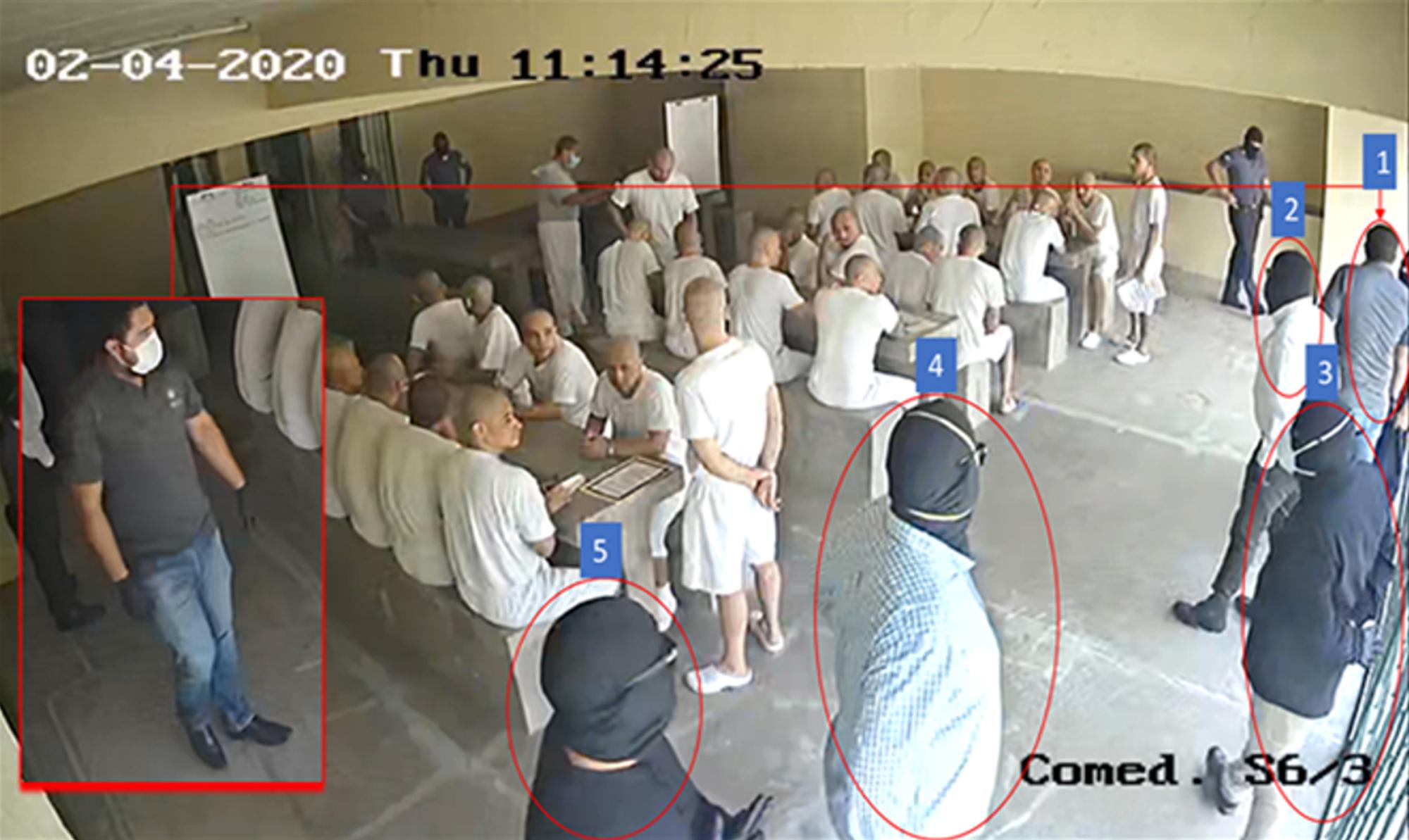 Luna (labeled 1) and four men in balaclavas meet with more than 20 prisoners on April 2, 2020. An internal prison report noted that they brought with them dominoes, chess, and "four special Bibles."