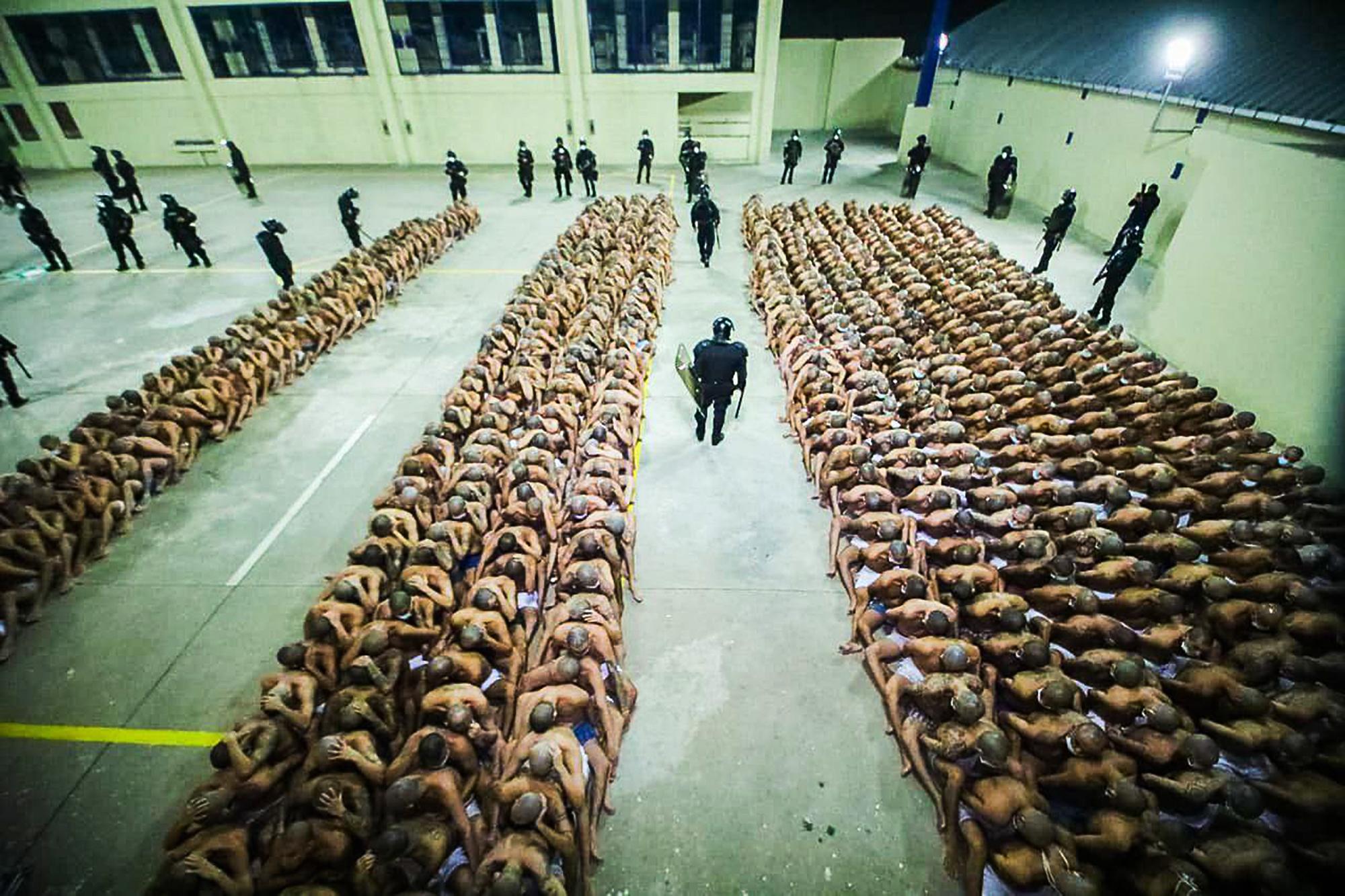 Prisoners in the Izalco Penitentiary sitting in lines during an operation. There had been 60 murders in three days across El Salvador—an uptick in violence that, according to the government, the gangs orchestrated from behind bars. Photo: Directorate General of Prisons