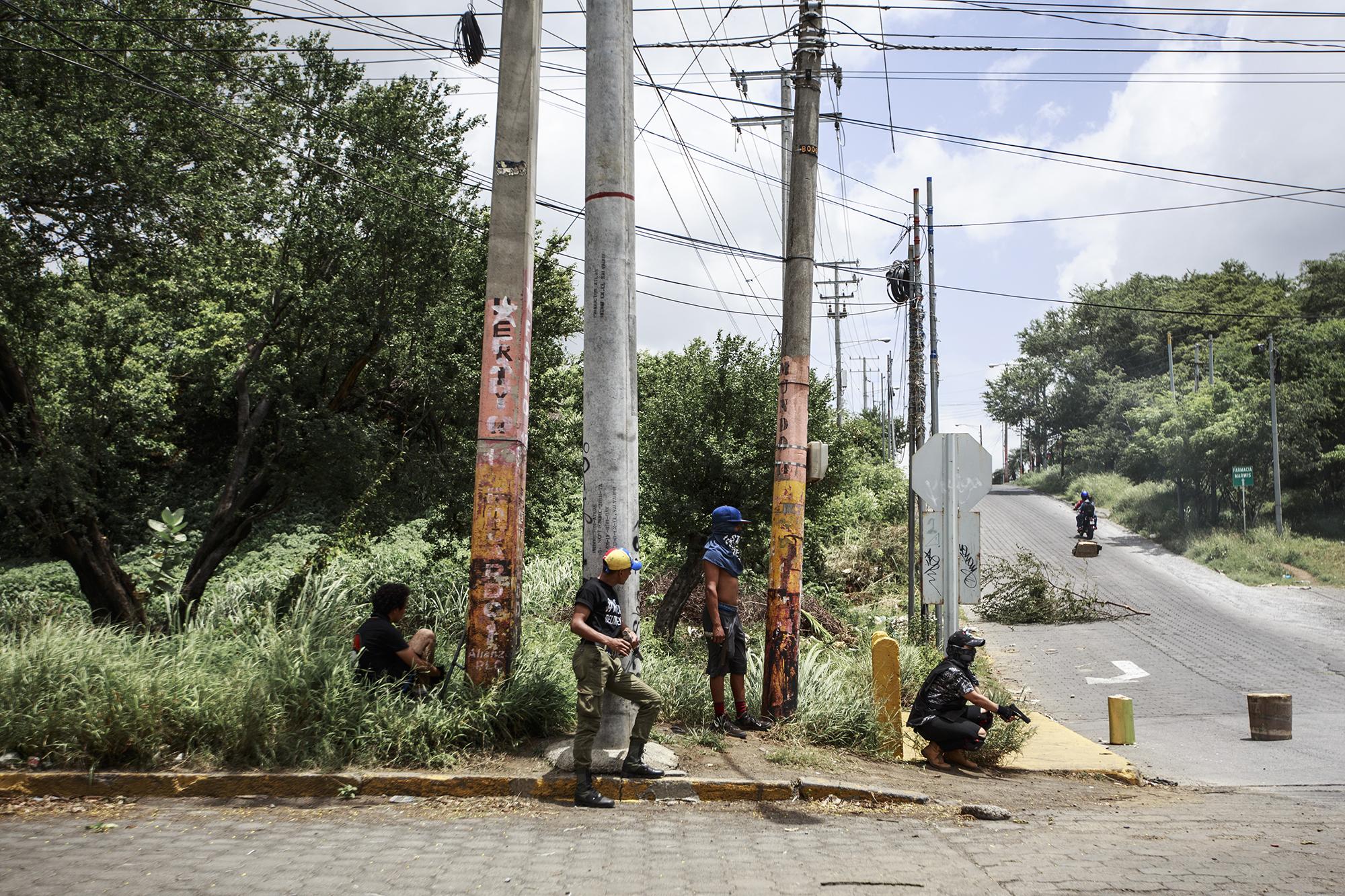 Students armed with makeshift mortars, shotguns, and 9 millimeter pistols guard one of the UNAN entry points following a police assault on Saturday, June 30, 2018.