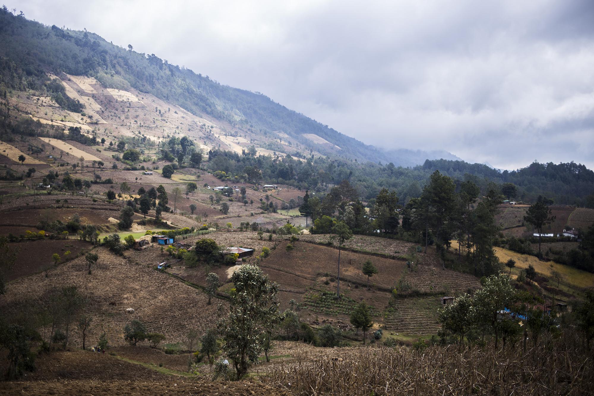 Guatemala’s Ixil region spans the towns of Santa María Nebaj, San Gaspar Chajul, and San Juan Cotzal. The villages here, which suffered the worst massacres of the war, are remote and isolated, bounded by fields and hills: homes of wood surrounded by crops. The villages are located 300 kilometers, or about 185 miles, from Guatemala City.