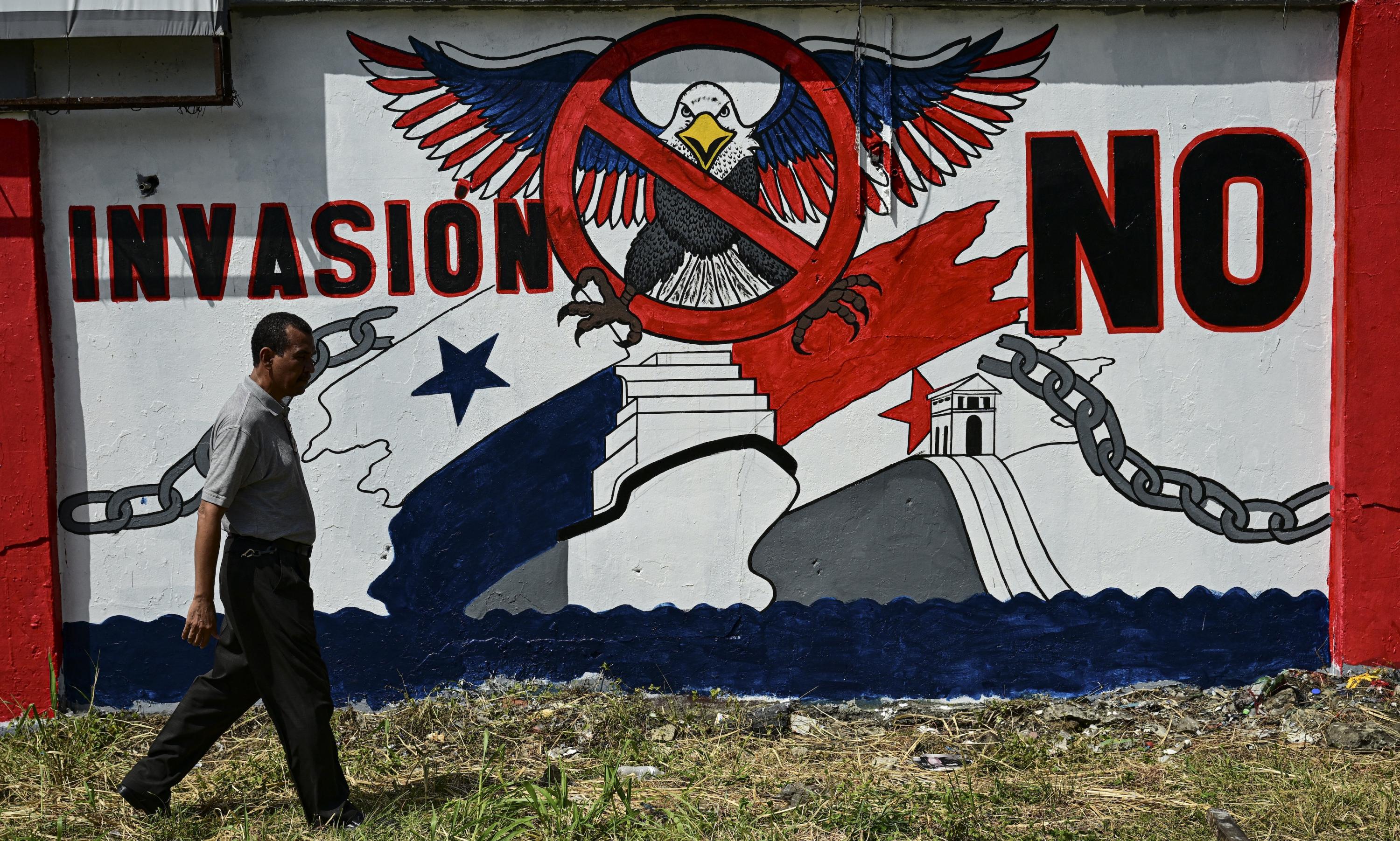 A man walks past a mural that reads “No invasion” in Colón, Panama on Jan. 29, 2025 prior to a visit by U.S. Secretary of State Marco Rubio. Photo Martin Bernetti/AFP