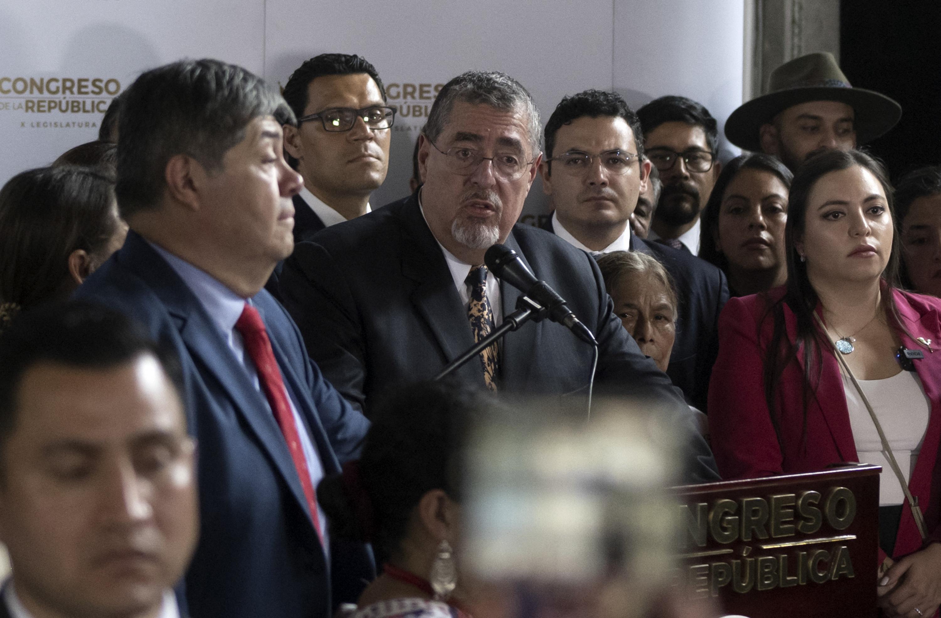 Guatemalan President Bernardo Arévalo (center) holds a press conference presenting legal reforms to Congress that would allow new grounds for removal of the country