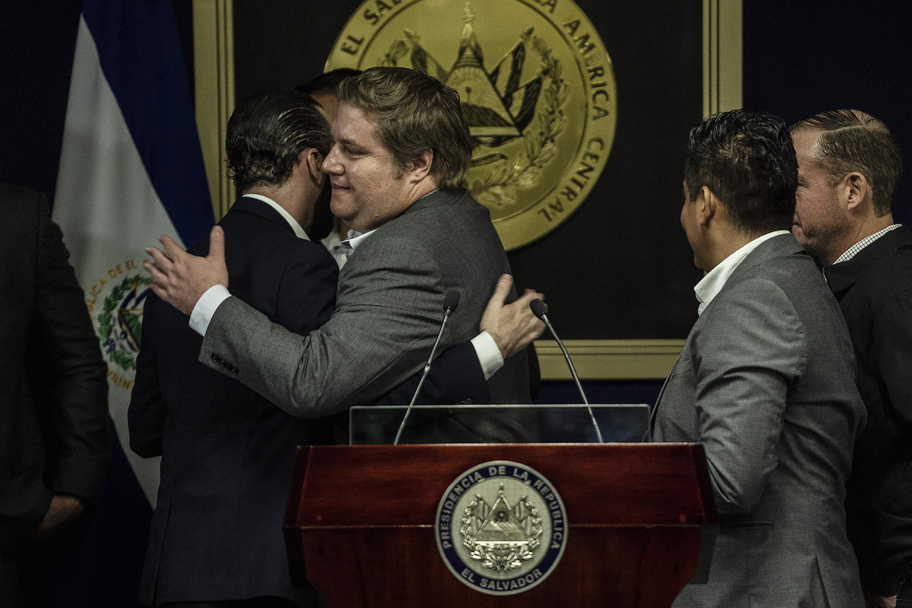 Salvadoran Agriculture Minister Pablo Anliker and President Nayib Bukele embrace after the announcement of Phase Two of the Territorial Control Plan at Casa Presidencial, on July 2, 2019. Photo Carlos Barrera