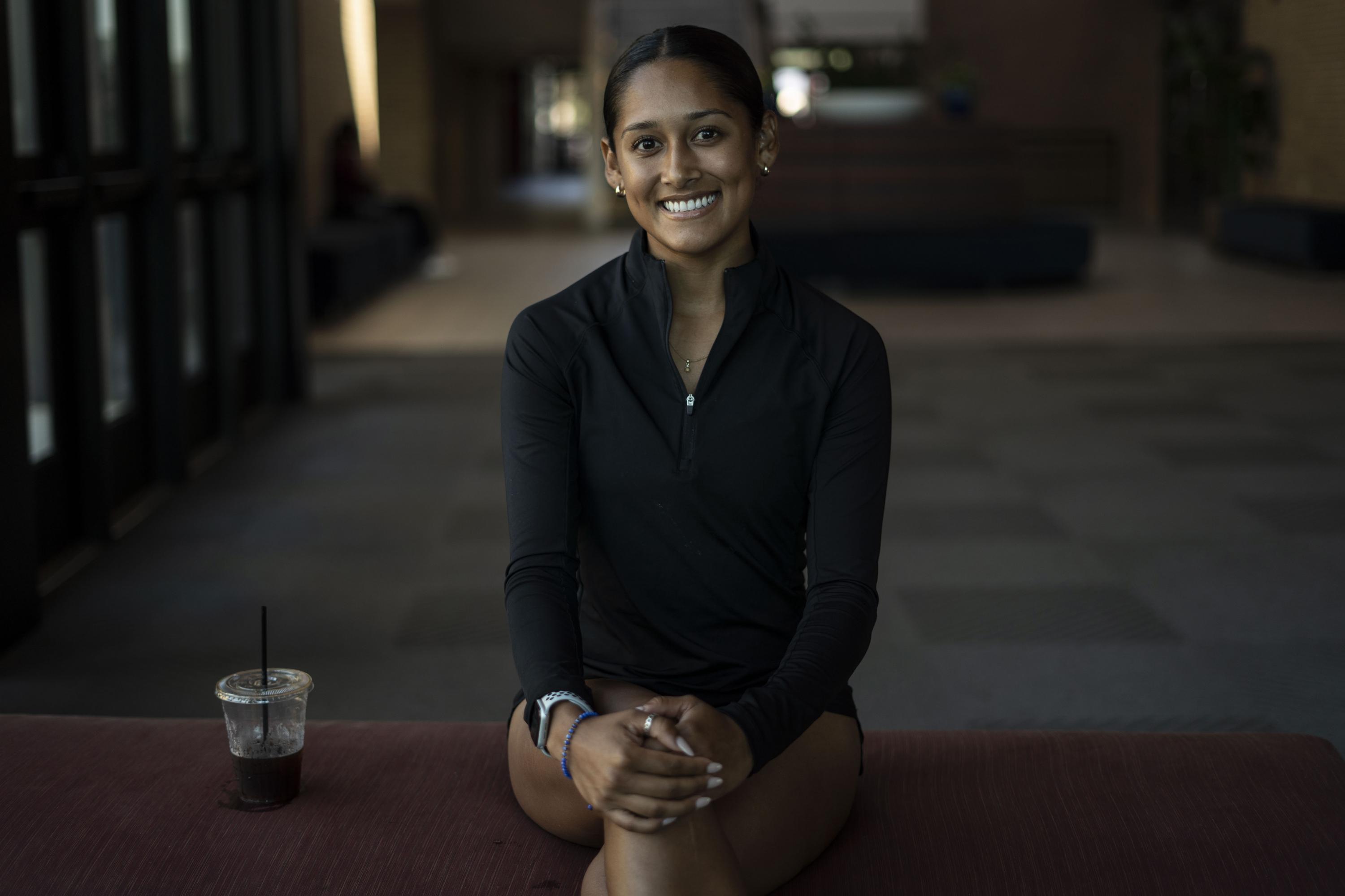 Juana Plata with her black coffee, no sugar, during an interview with El Faro English. Players said they are regularly scolded by Salvadoran coach Eric Acuña to reinforce eating and drinking habits.