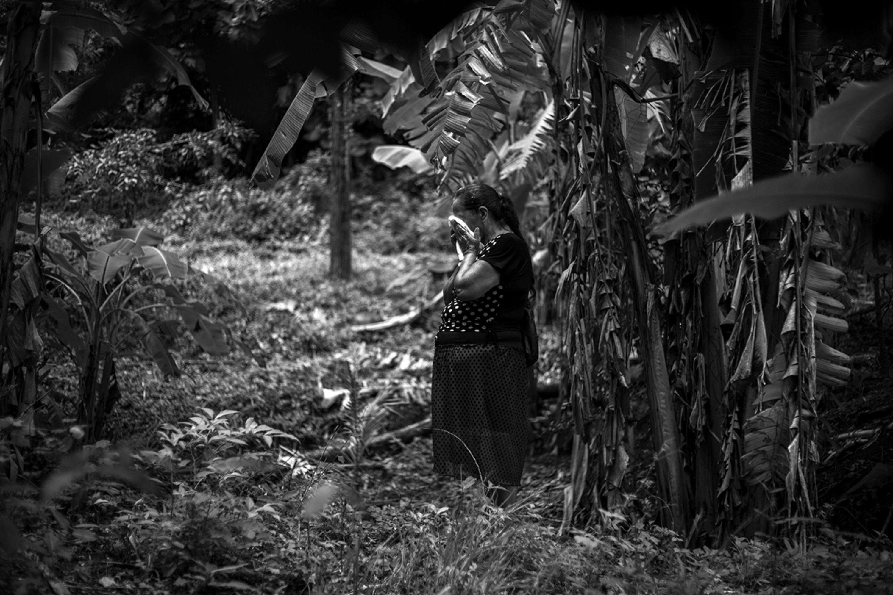 Reina Martínez Cisneros, a survivor of Canoas, stands in front of the grave where her husband, Emérito Nolasco Sandoval, was buried. According to Reina, he was shot in the head. In nine years, the two DNA tests that the authorities have performed on the skeletons have not given the results to determine the consanguinity between the remains and his relatives.