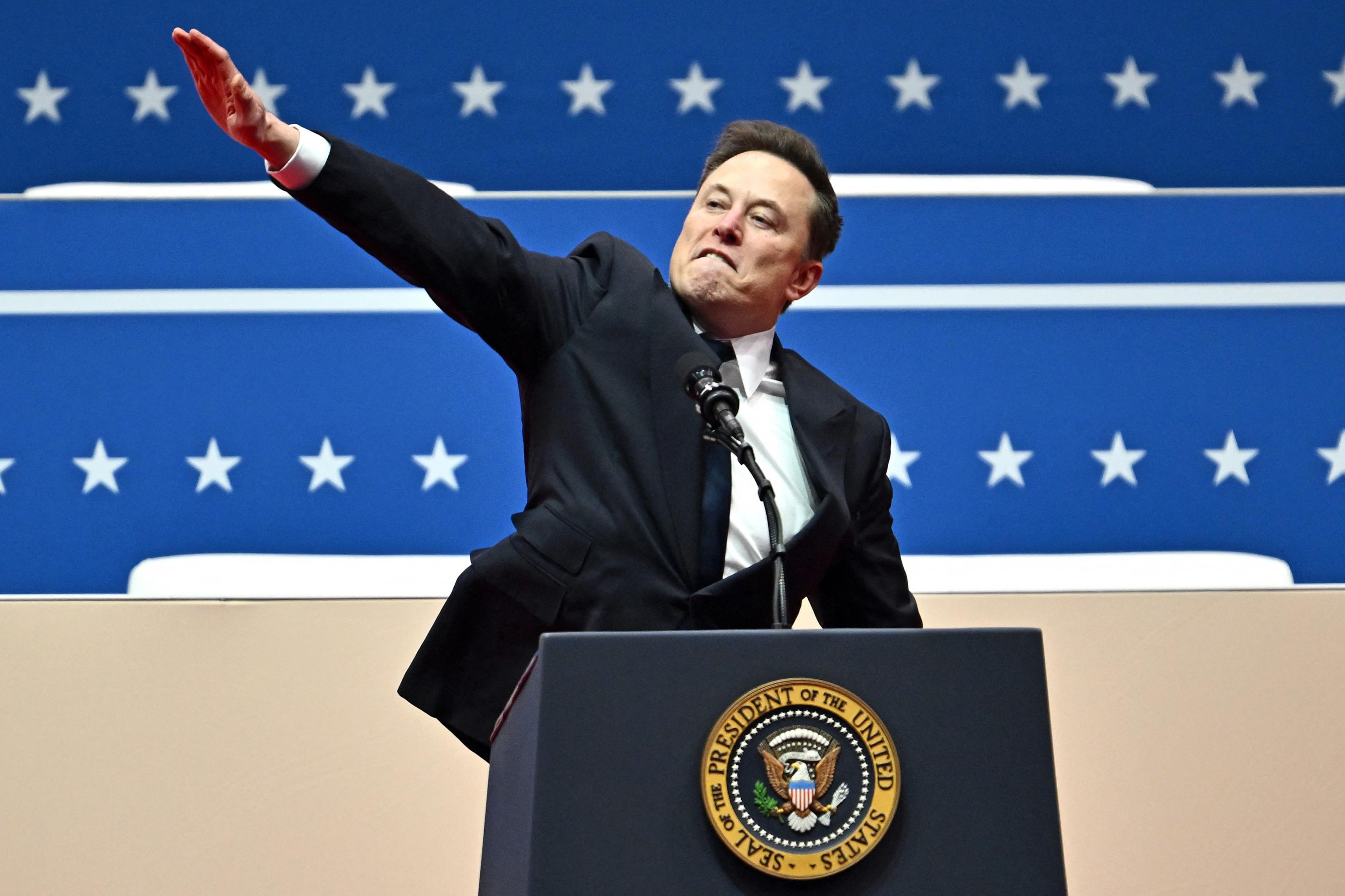 Elon Musk, CEO of Tesla and SpaceX and an official of the second Trump administration, during the inaugural parade inside Capitol One Arena in Washington, D.C., on Jan. 20, 2025. Musk’s hand gestures at an inauguration event for U.S. President Donald Trump quickly drew comparisons to Nazi salutes. The billionaire brought his hand to his chest and extended it twice before saying, “My heart is with you.” Photo Angela Weiss/AFP