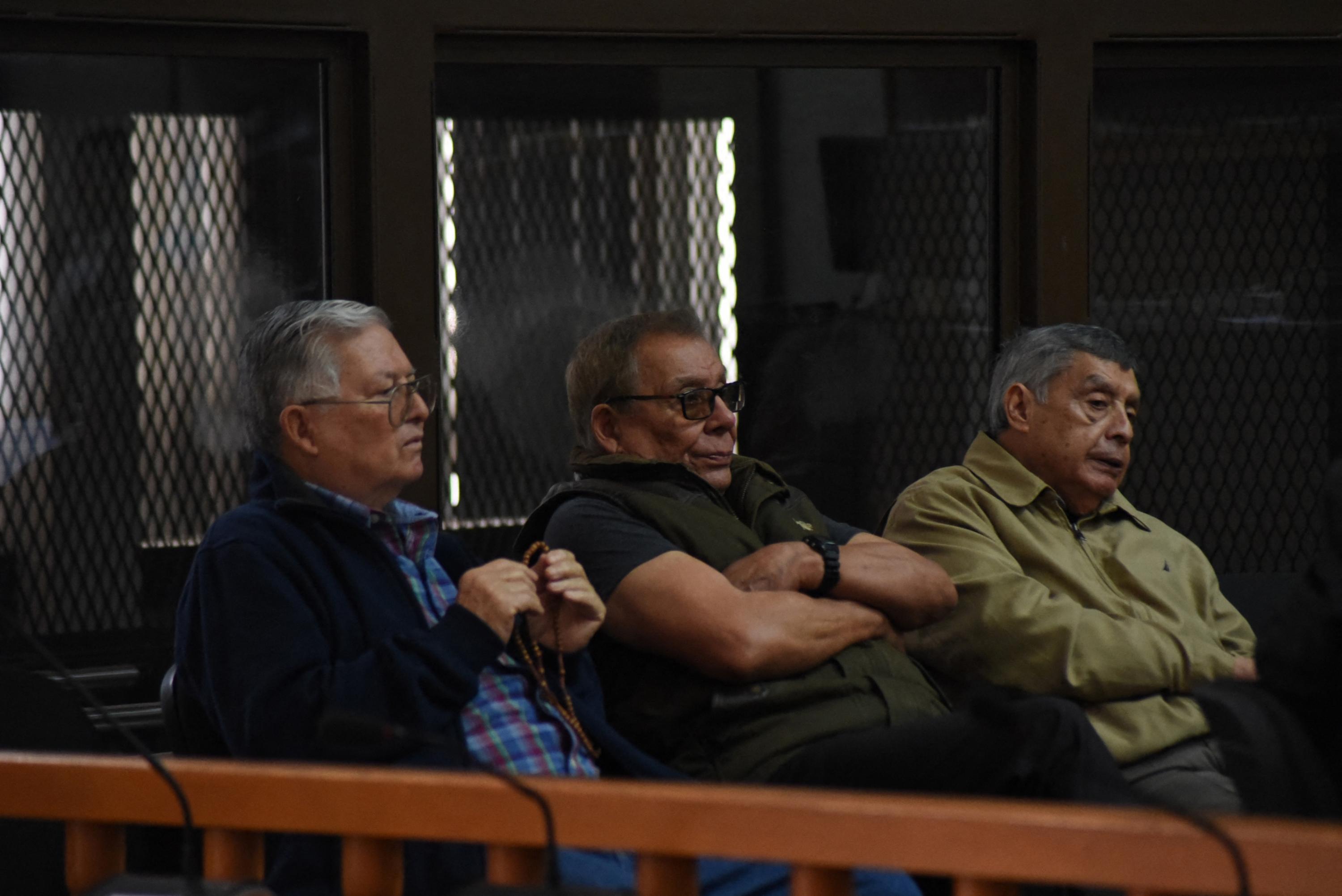 Former Guatemalan Army commanders Benedicto Lucas García (center), Manuel Callejas y Callejas (right), and César Octavio Noguera Argueta in a Guatemala City on Nov. 25, 2019 after a criminal investigation was launched against the men for their alleged involvement in the Maya Ixil genocide during the Guatemalan internal armed conflict. Photo Orlando Estrada/AFP