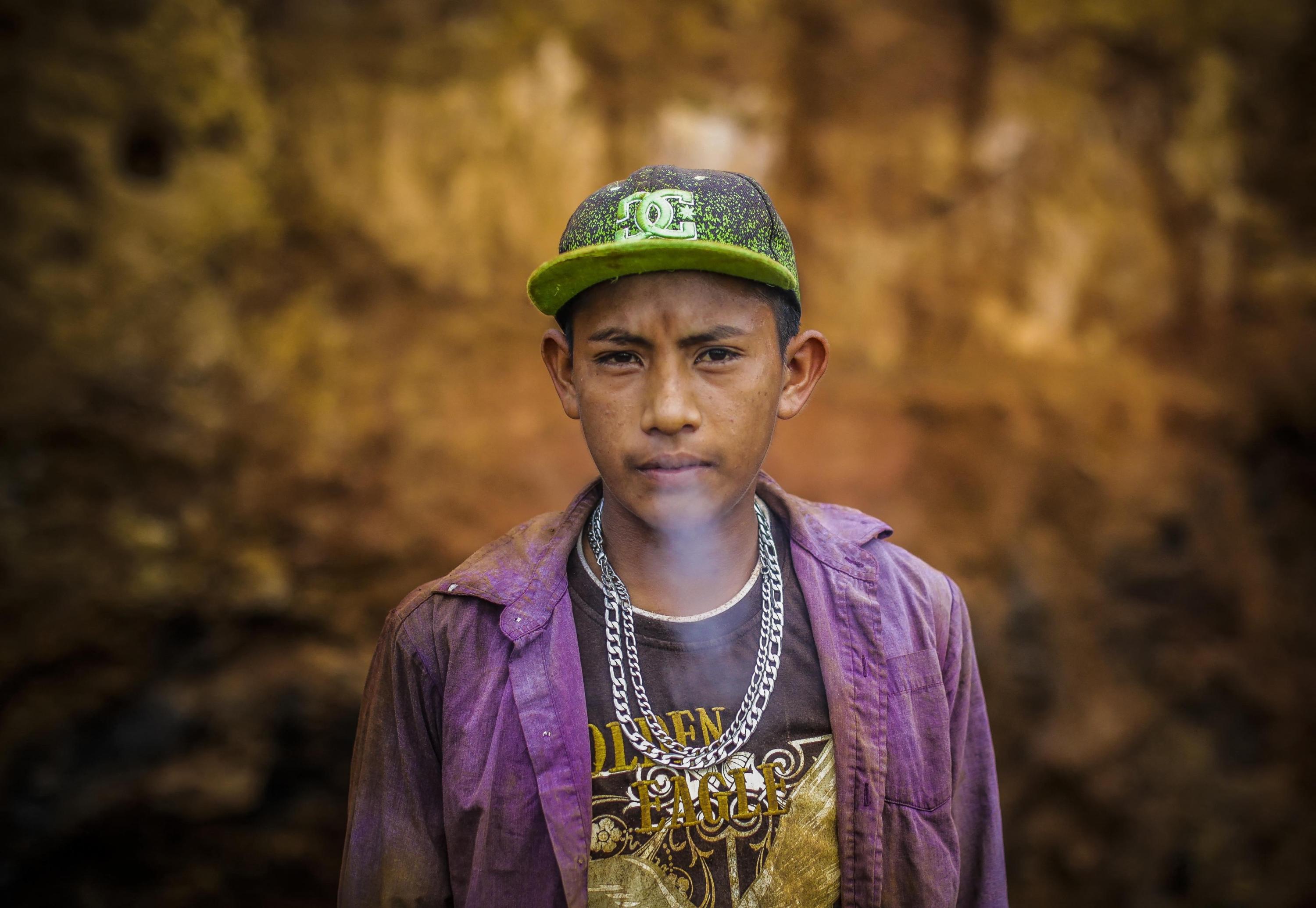 A young miner smokes a cigarrette in the IRON gold mine some 10 km from the town of Rosita in the North Caribbean Coast Autonomous Region in northeast Nicaragua, on Mar. 6, 2017. Local men, women, and youngsters eke out a living as “güiriseros” or artisanal gold miners, selling the crushed rock to a mining company in Bonanza or extracting the gold to sell to local jewellers. Photo Inti Ocon/AFP