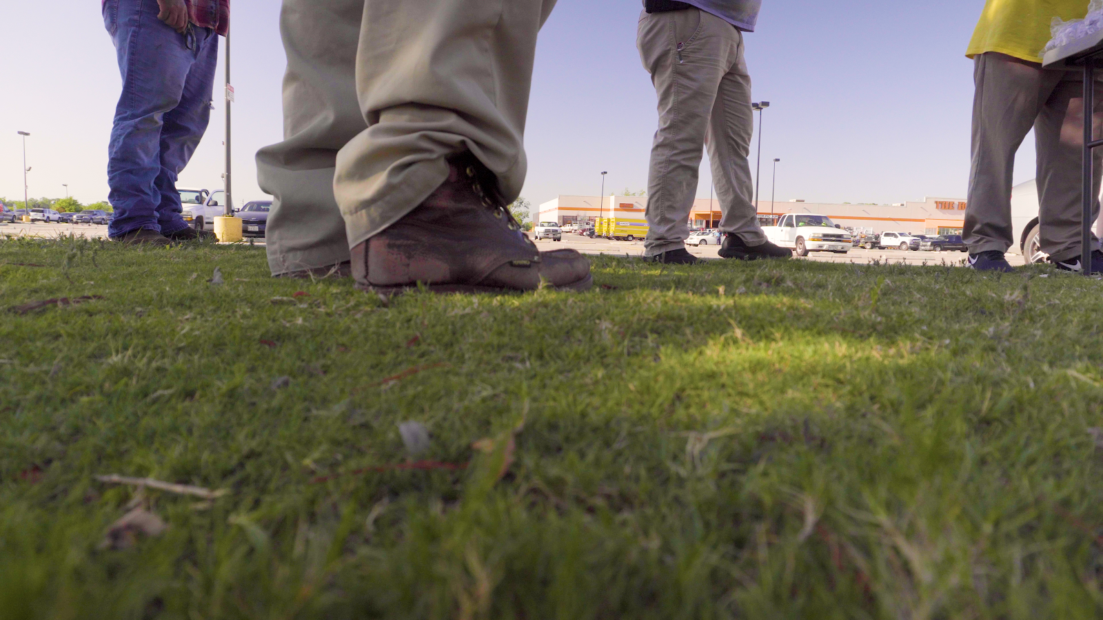 Workers standing on the outskirts of a Home Depot parking lot in Houston, Texas. Photo by: José Luis Martínez