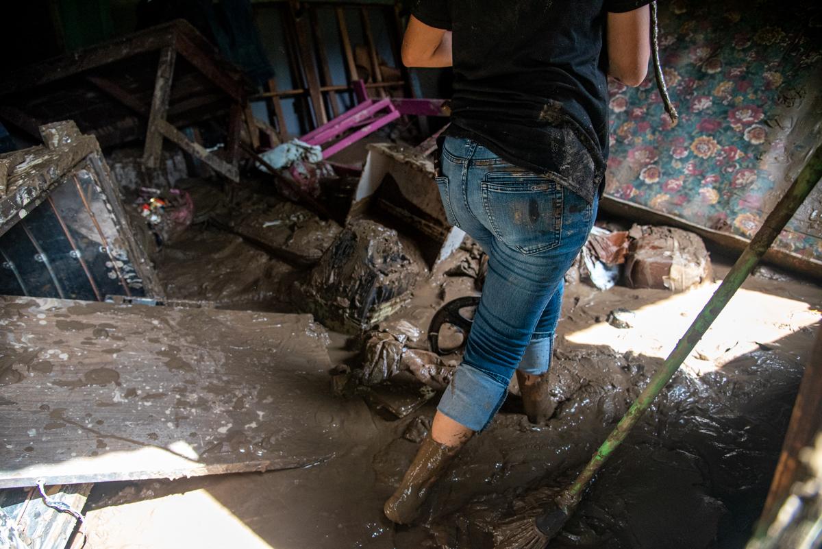 A woman walks through her flooded home in San Pedro Sula, Honduras after the Chemelecon River flooded in the wake of Hurricane Eta. Flooding in the aftermath of Hurricane Eta has displaced hundreds of thousands in Honduras. There are many missing people and the death toll is expected to rise.
