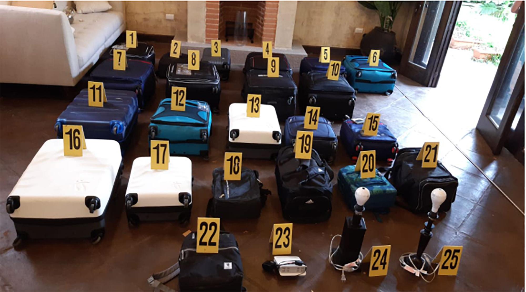22 suitcases stuffed with cash. Photo from the Guatemalan Attorney General