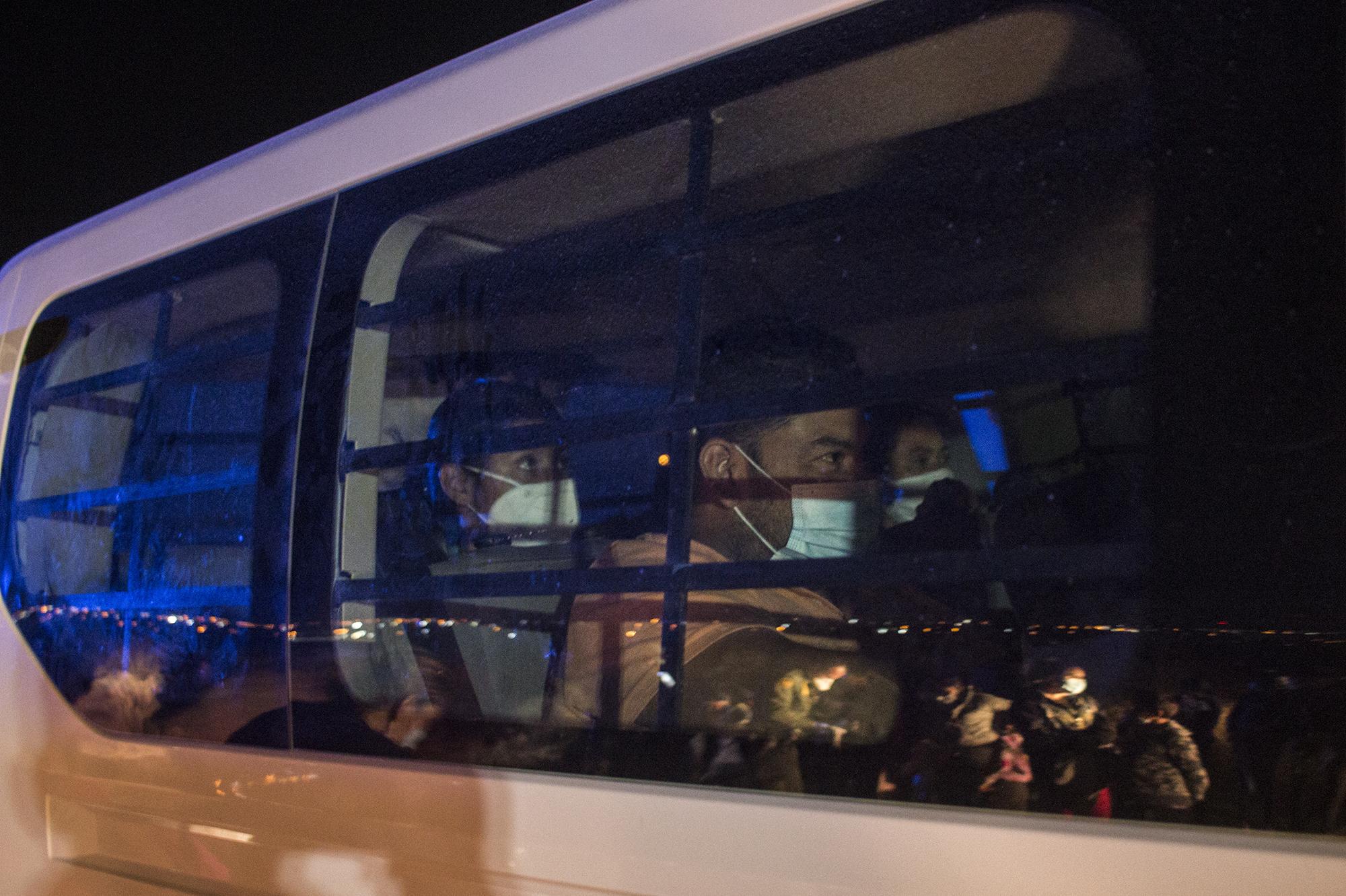 Ten adults in this Border Patrol truck, along with some children, turned themselves in. The radio chatters information about their transfer to Carrizo Springs, a detention center some 220 miles away near San Antonio Texas.