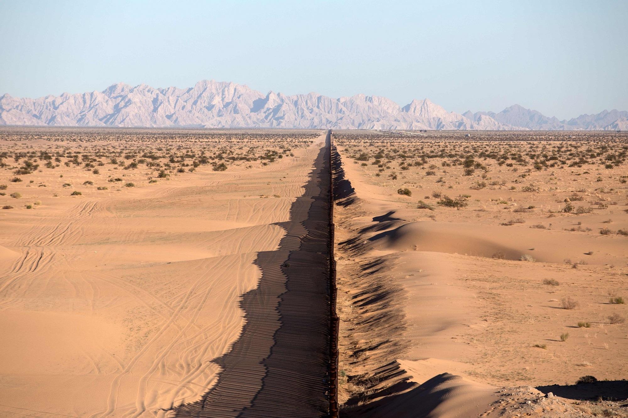This file photo taken on February 15, 2017 shows a section of the US/Mexico border fence seen at San Luis Río Colorado, Sonora state, in northwestern Mexico. With debate raging in the United States and Mexico over President Donald Trump