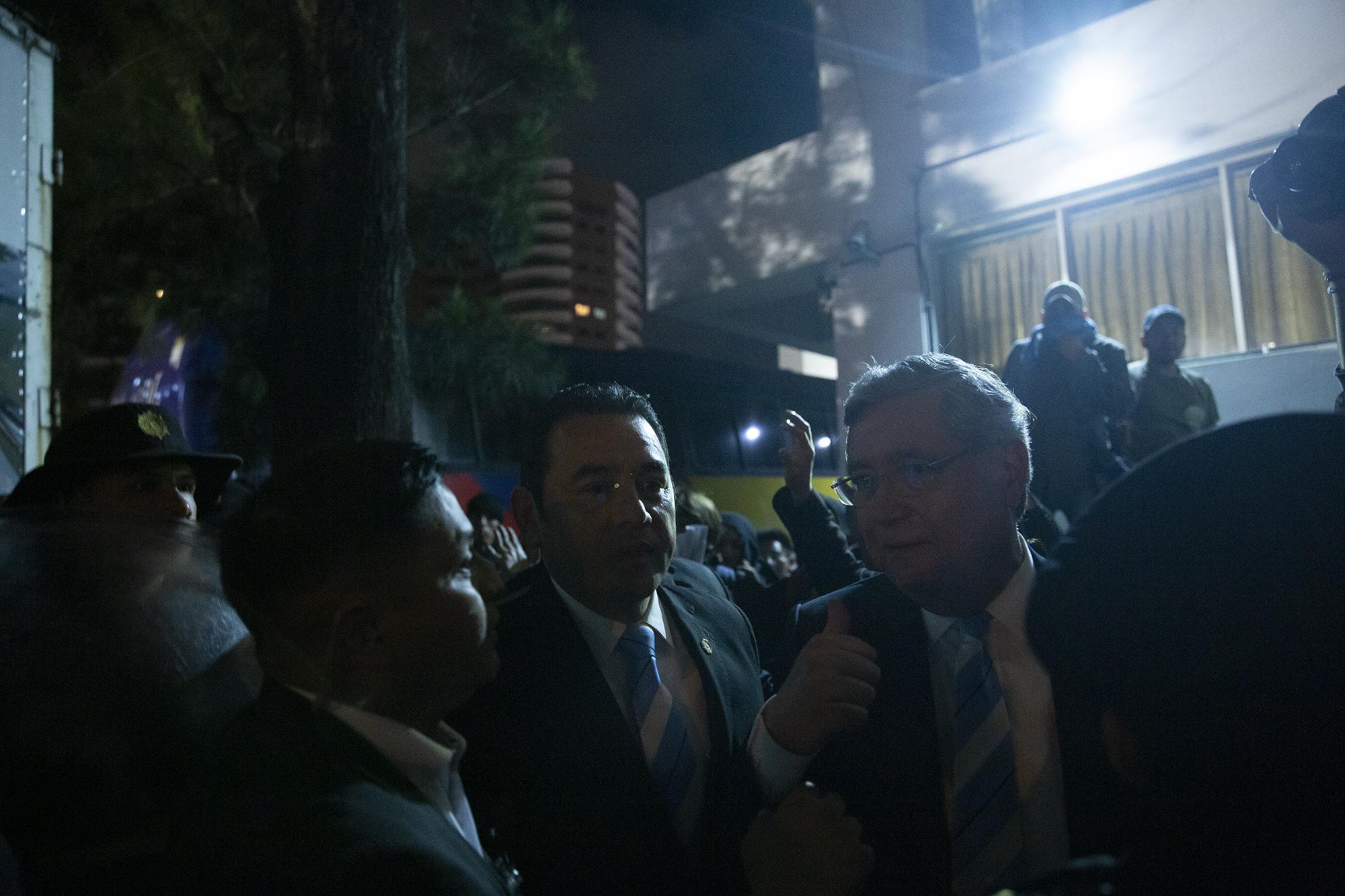 Photo caption: Former president Jimmy Morales tried to flee from protestors attempting to block him from reaching his inauguration as a Guatemalan representative to Parlacen on January 14, 2020. The protestors managed to hit Morales and pelt him with eggs. Photo by Carlos Barrera.