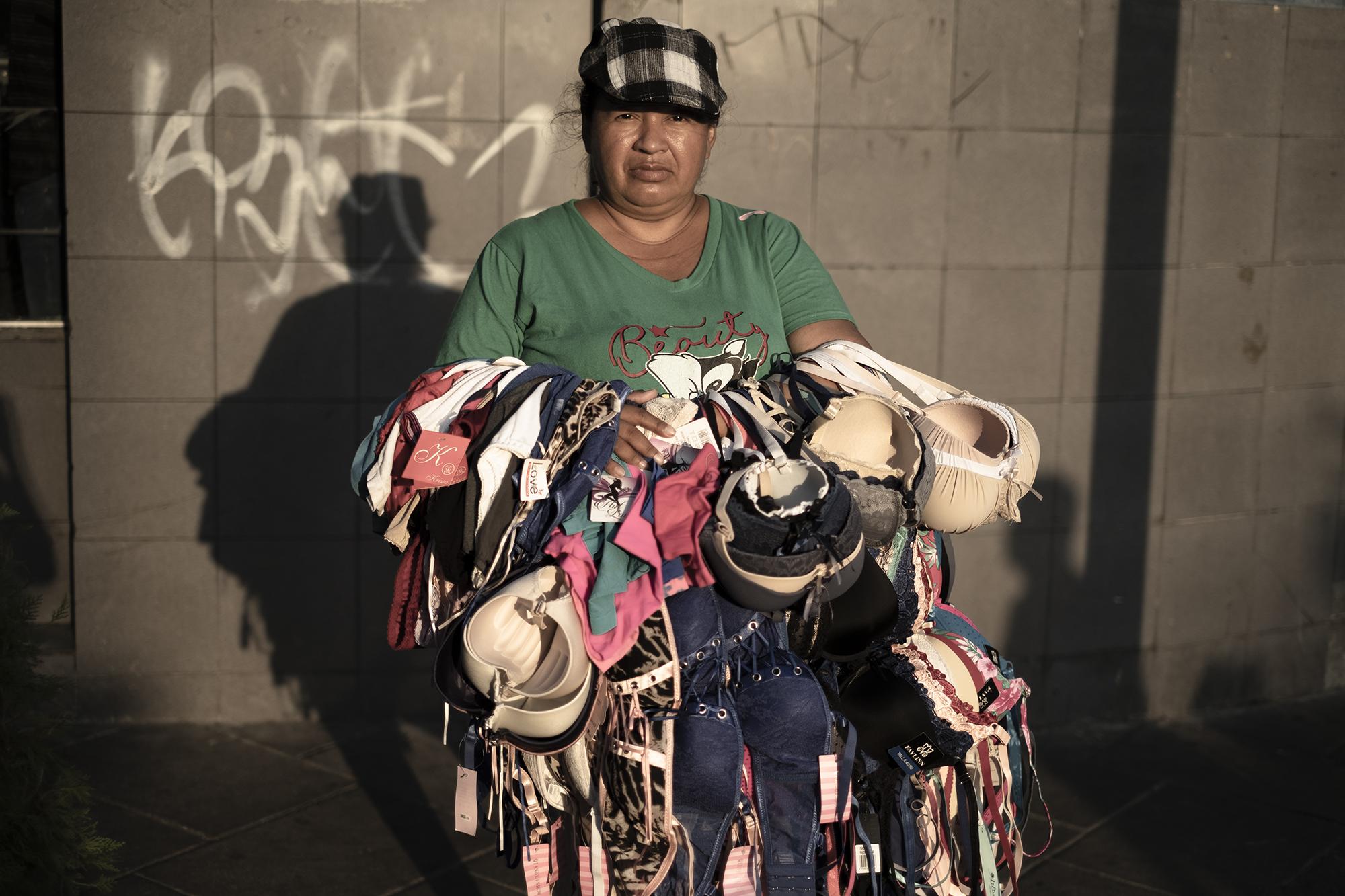 Delmy Cornejo, 43, lives in the San Antonio neighborhood of Soyapango and travels on foot as a lingerie vendor, earning $10 on a good day. “They’ll have to pull us off the job by force,” she said. “You have to earn your meal every day. People with money buy things for their stashes, but we can’t even get to the supermarket.”