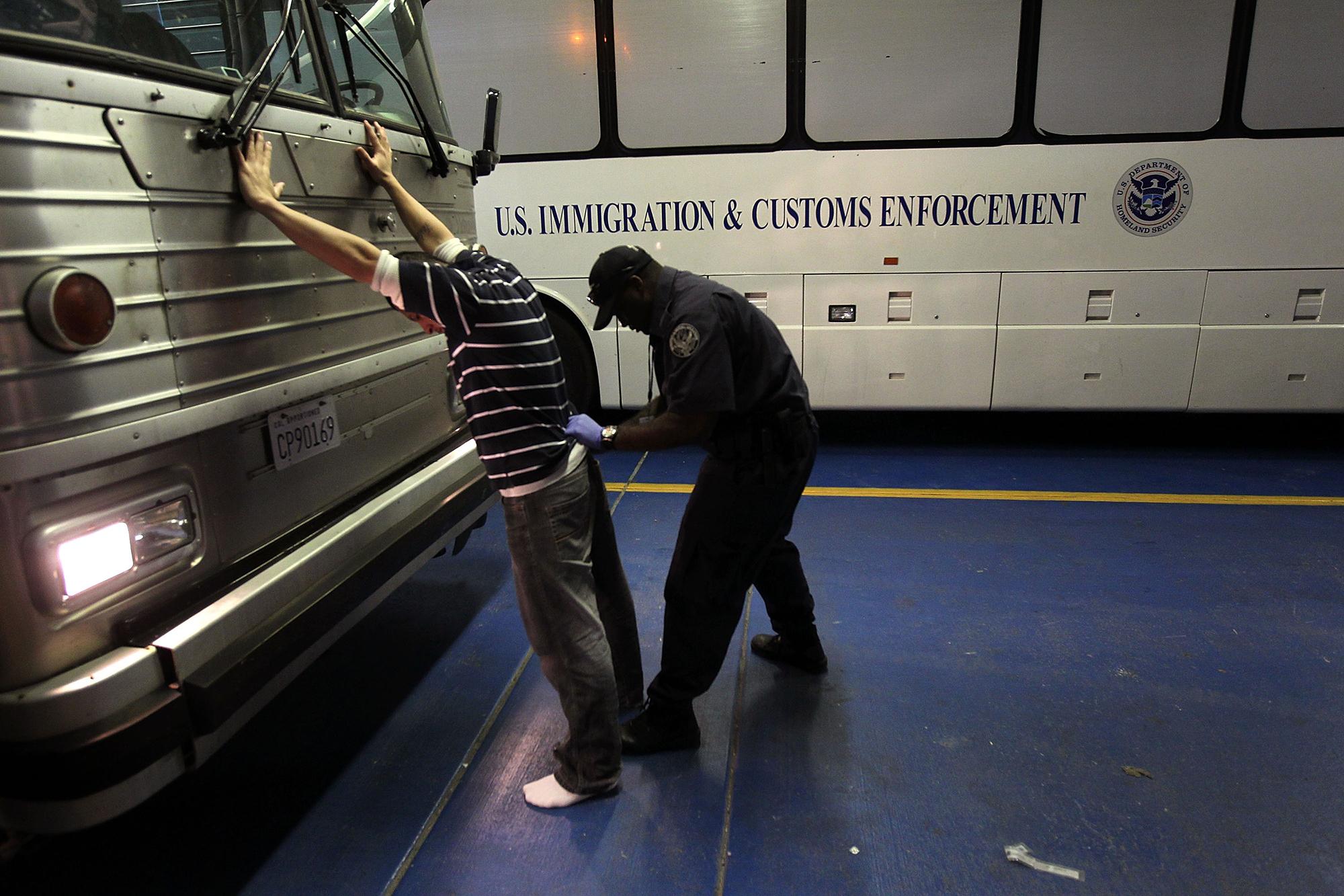 PHOENIX - APRIL 28: An undocumented Mexican immigrant is searched while being in-processed at the Immigration and Customs Enforcement (ICE), center on April 28, 2010 in Phoenix, Arizona. Across Arizona, city police and county sheriffs