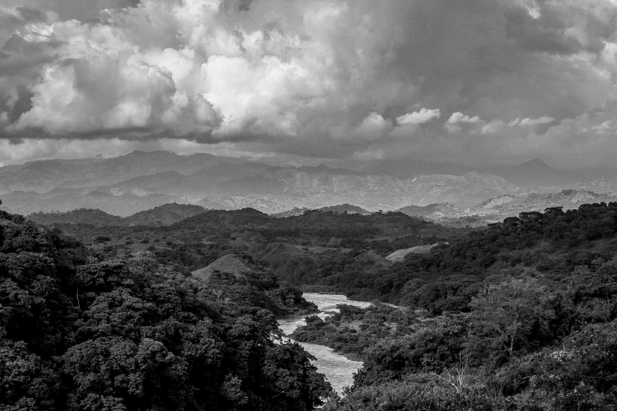 A view of the Lempa River from Piedras Coloradas, the area where thousands of refugees crossed through on March 18th, 1981, fleeing war and a barrage of bullets and mortars launched by the Salvadoran Air Force. On the left bank of the river is Honduras.