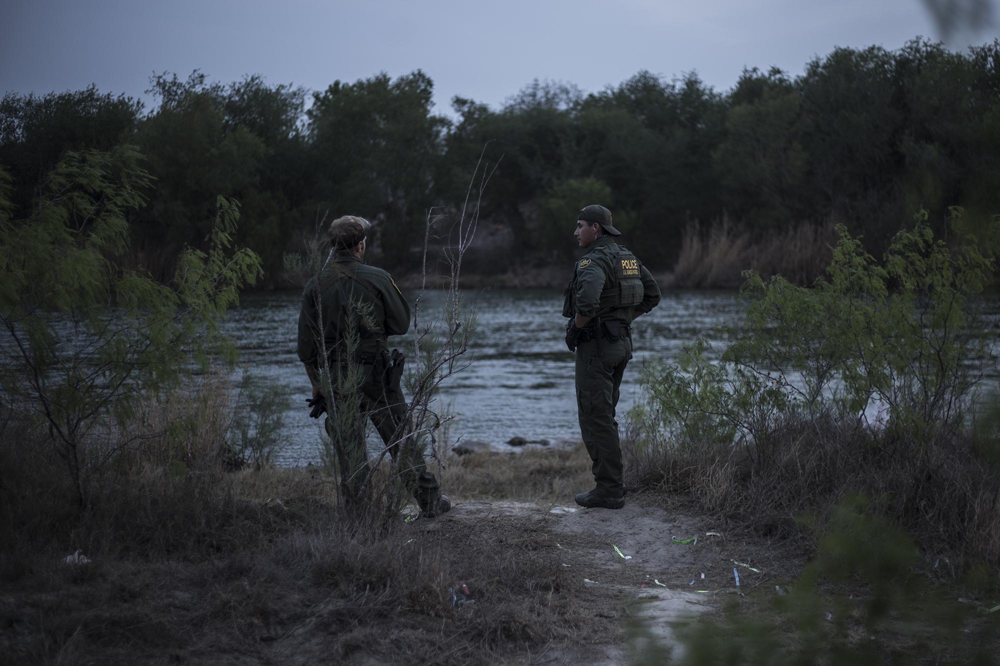 “You can’t cross today. The Texas Rangers are in the area and they’ll arrest you,” two Border Patrol agents yelled in Spanish to the smugglers inflating rafts on the other side of the river. “Don’t do it today. Wait until tomorrow,” they shouted. The agents left a few minutes later, and the migrants disappeared into the hills along the riverbank, perhaps to try at another spot.