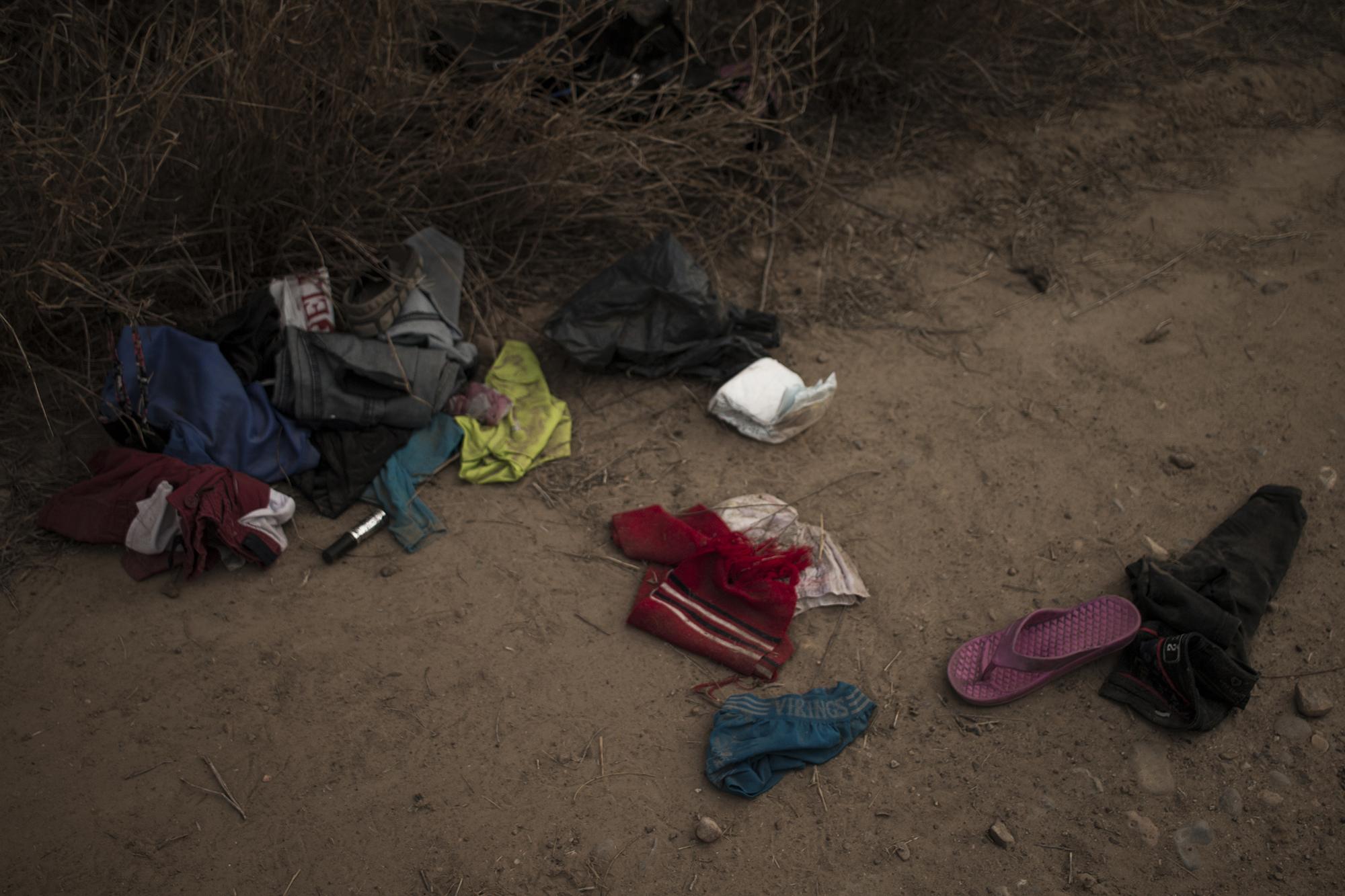 Families leave behind clothing and other items that got wet during the crossing: lipstick, underwear, shirts, diapers.