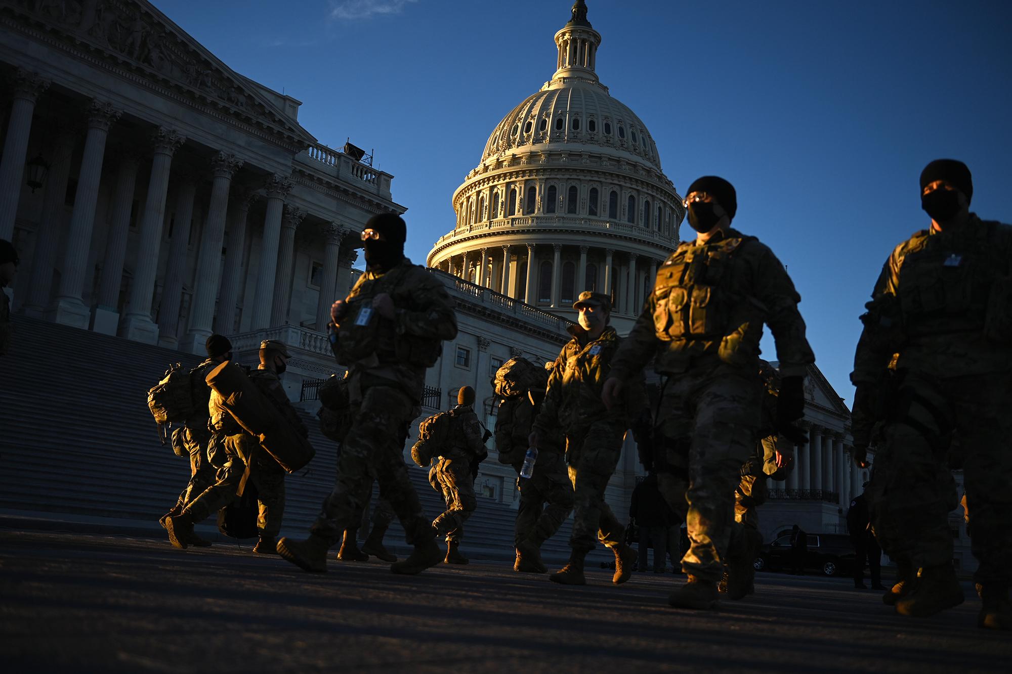 Members of the National Guard outside of the U.S. Capitol on Jan. 19, 2021, the day before the 59th innaugural ceremony of President Joe Biden and Vice President Kamala Harris. Photo: Brendan Smialowski/AFP