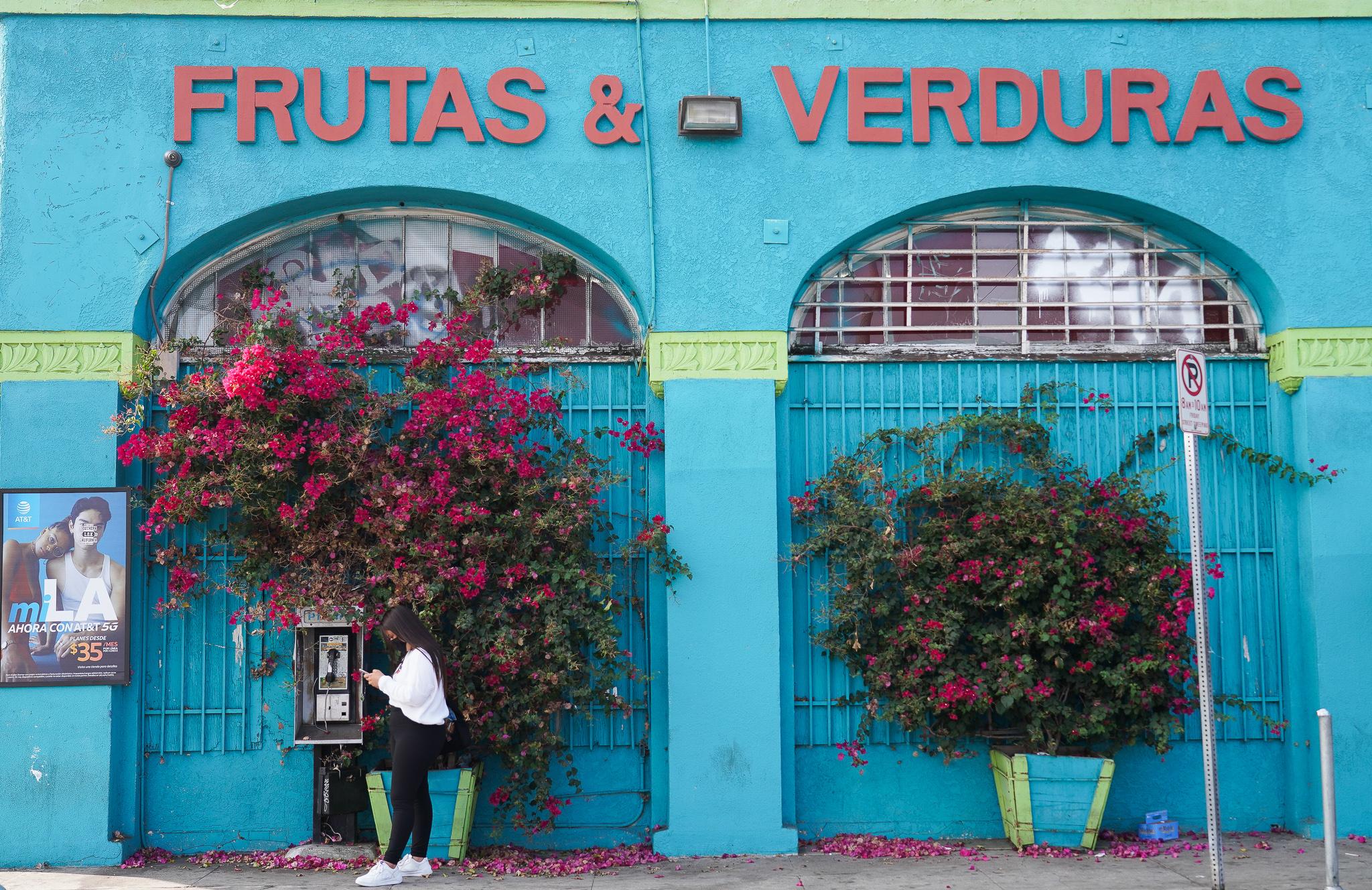 20-year-old Guatemalan-American Karla García walks to the voting poll near the intersection of Washington Boulevard and Magnolia Avenue in Los Angeles.