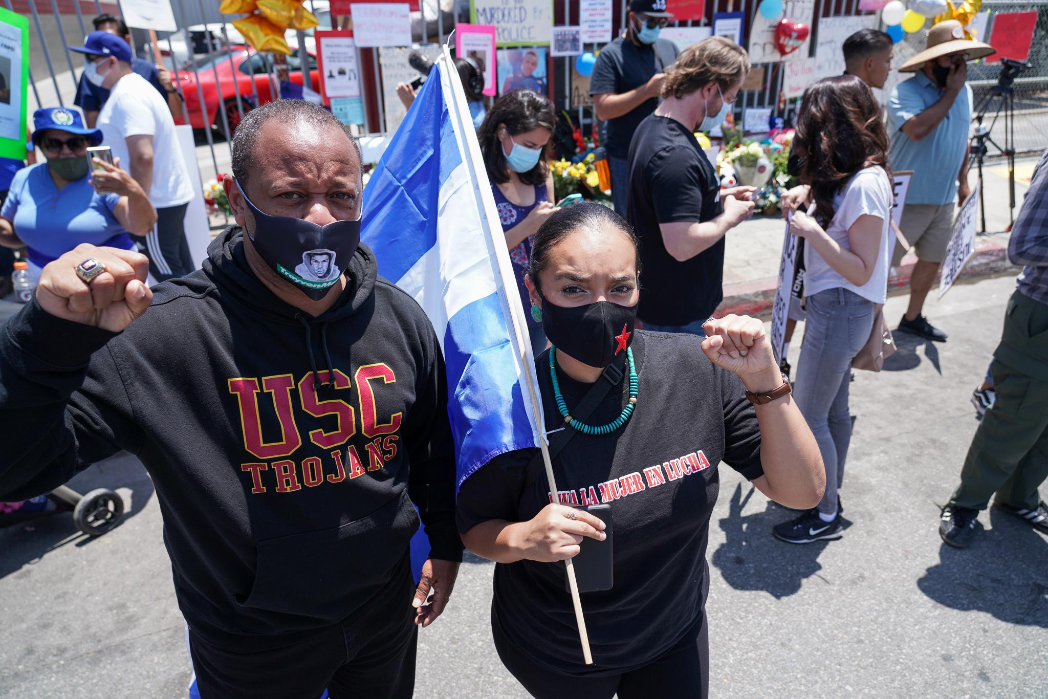 Long time South L.A. activist Najee Ali (left) joins forces with Unión del Barrio Immigrant Advocacy Group Desiree Gaytán (right) before the march started. Photo: Francisco Lozano