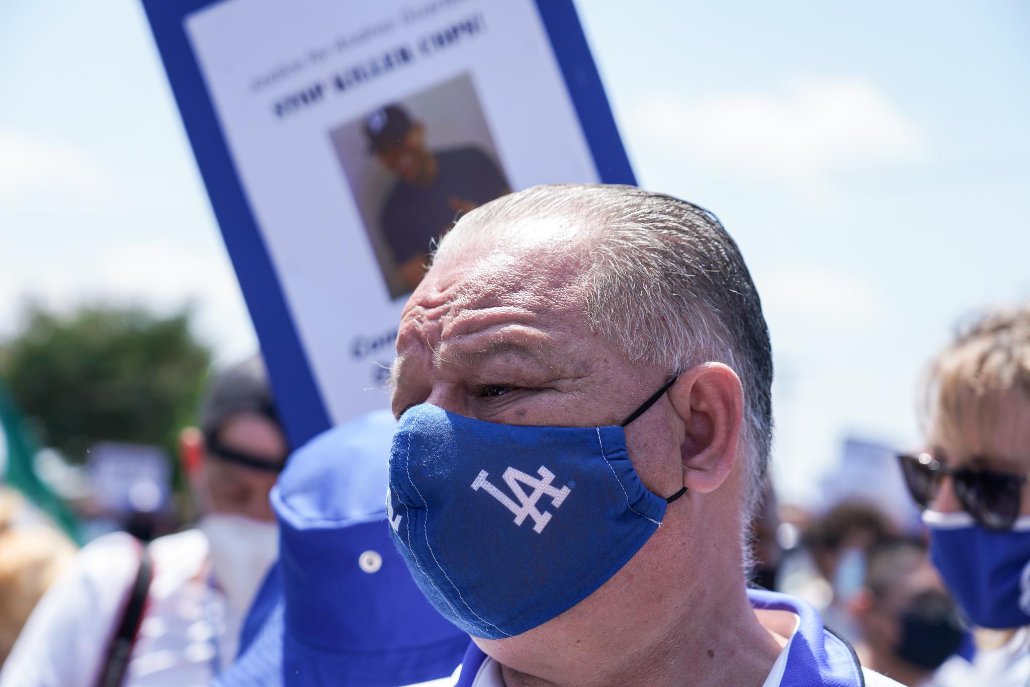 Cristobal Guardado, father of Andres Guardado, at the march and rally wearing an LA Dodgers mask, Andres