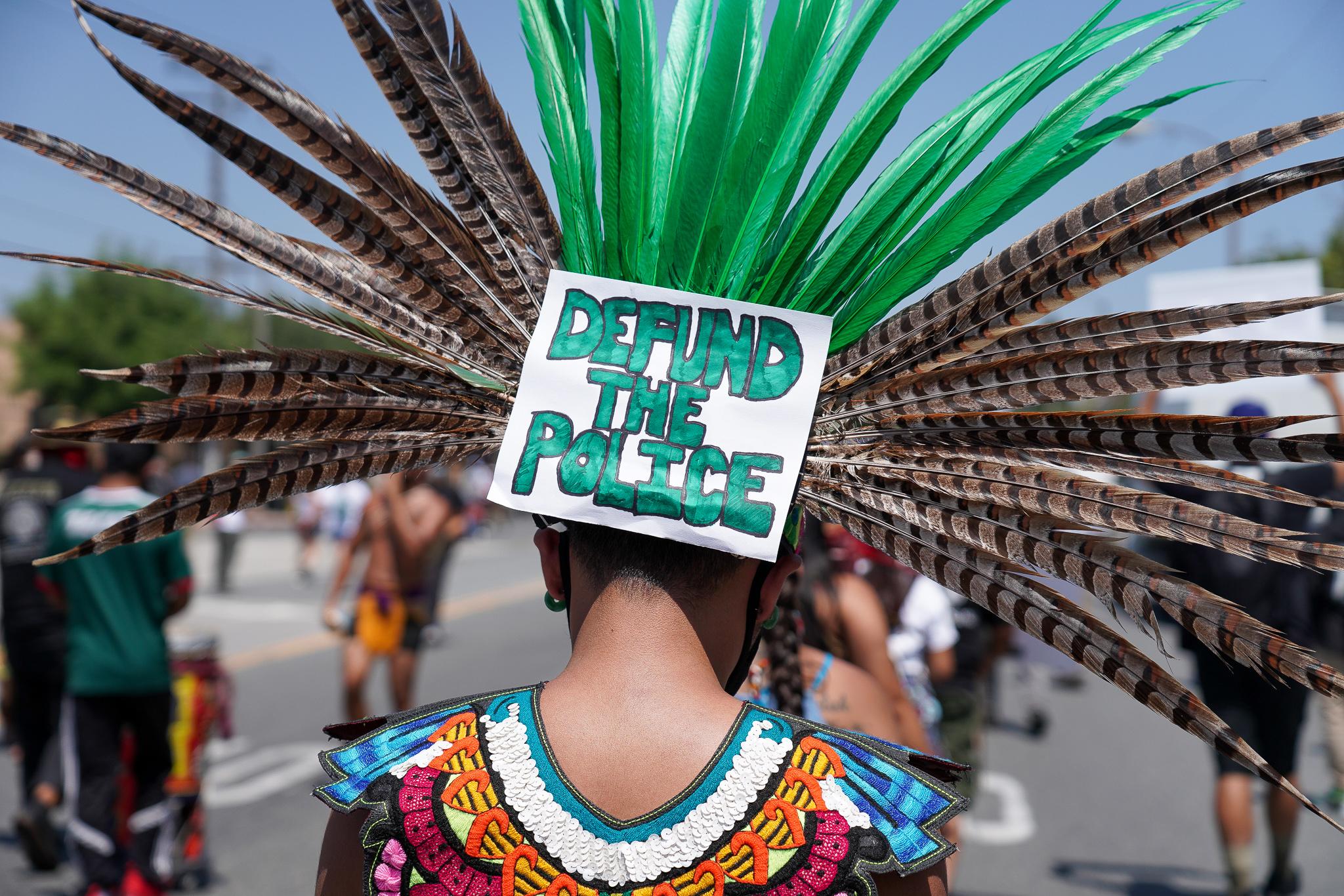 Aztec dancers joined the protest, and led the way for most of the three-and-a-half mile march. Photo: Francisco Lozano