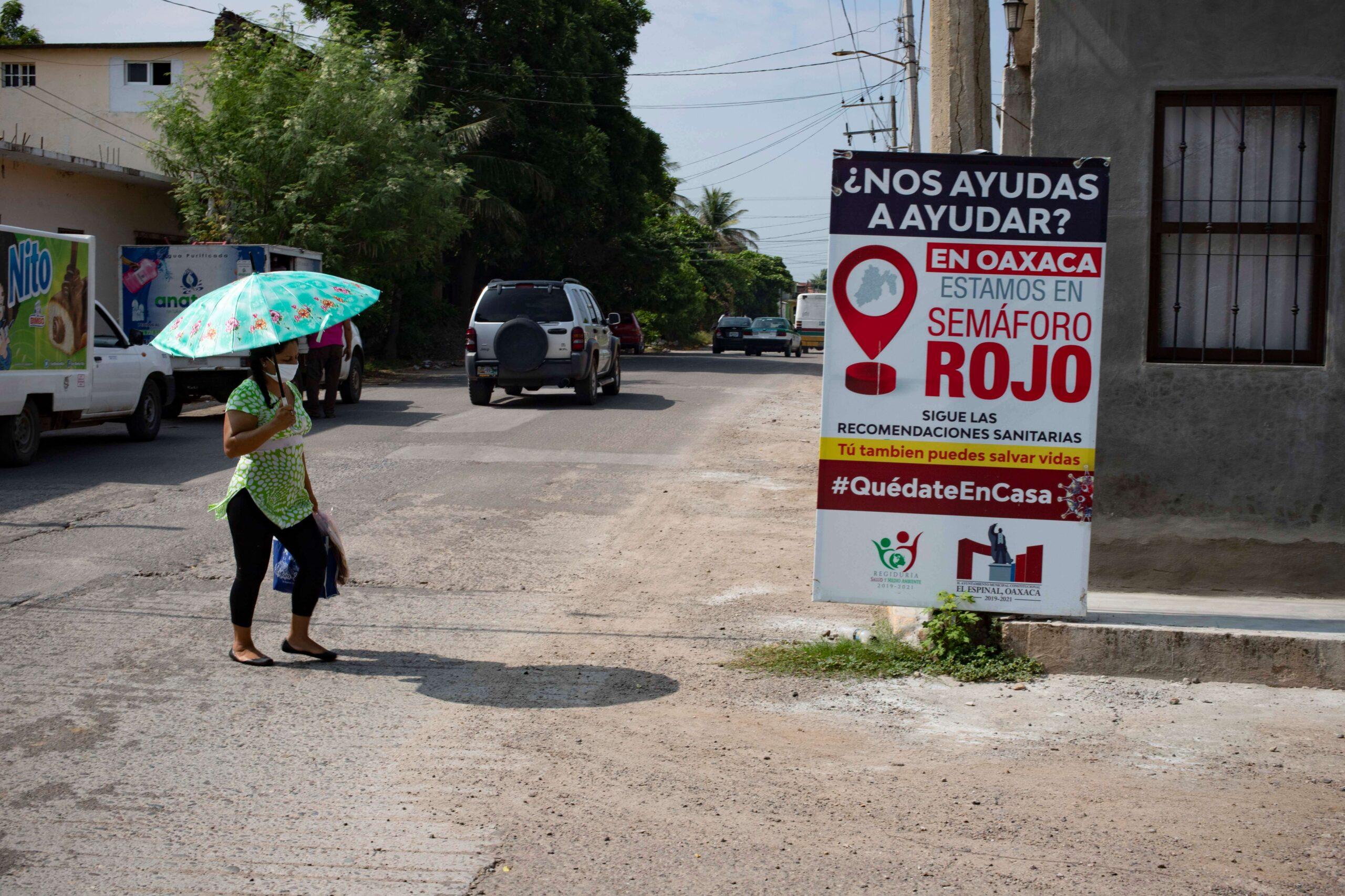 The streets of Ixtepec are plastered with pandemic warning signs posted by city officials / Javier García