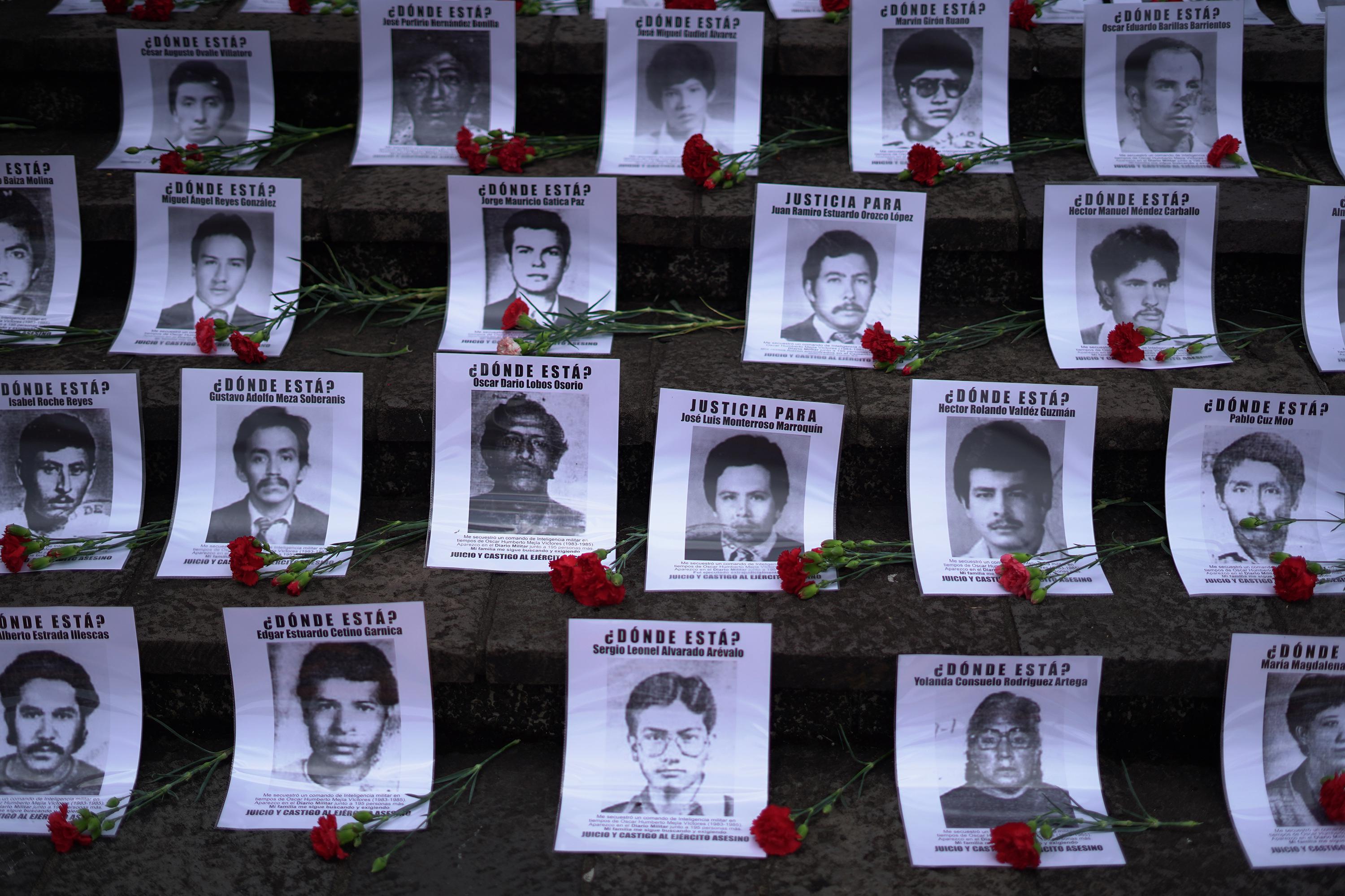 Demonstrators left a tribute to victims outside of the Palace of Justice in Guatemala City on June 7, 2021 during a hearing for the Diario Militar case, also known as the 