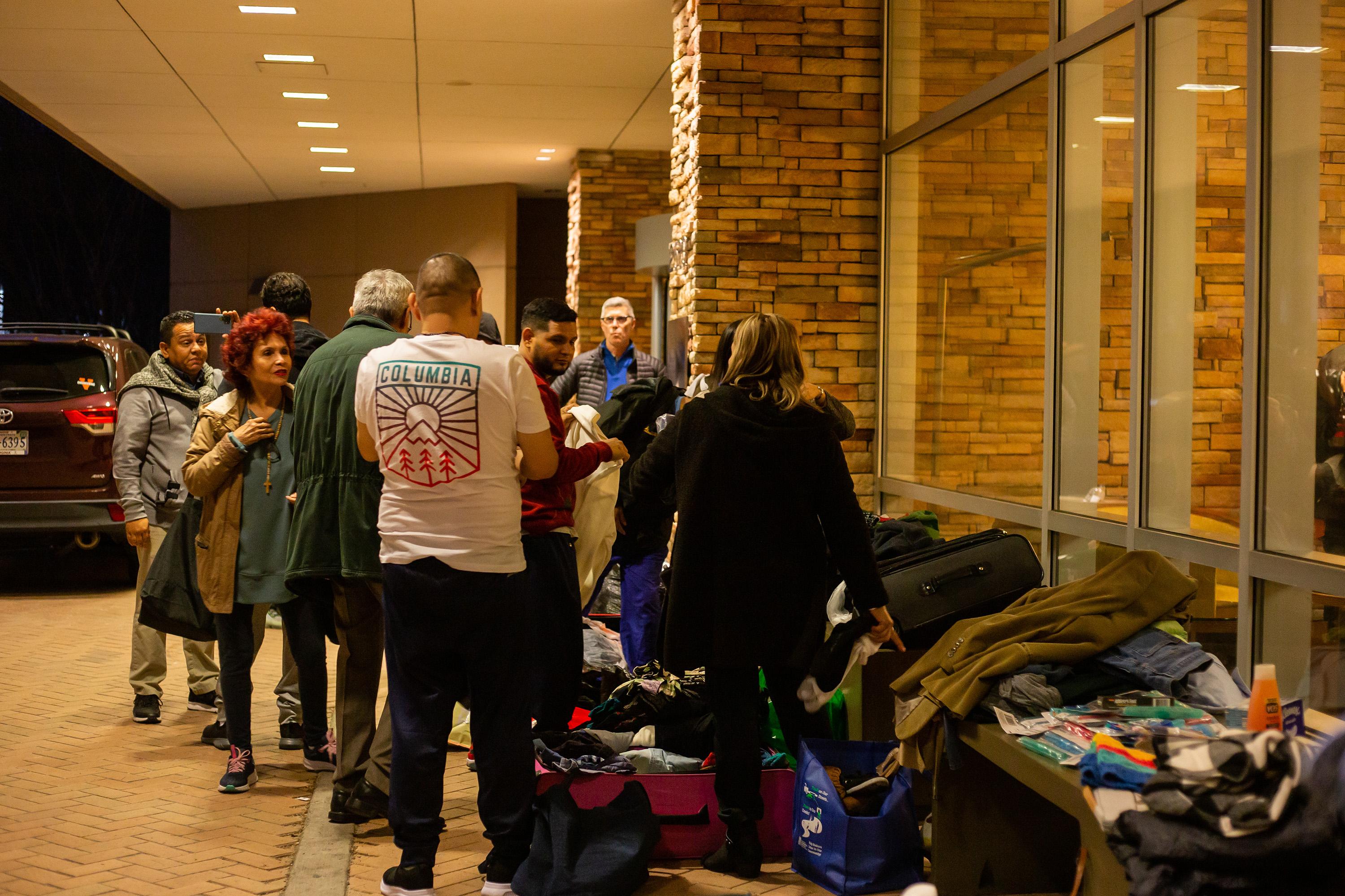 Former political prisoners choose clothing and other supplies donated by Nicaraguan diaspora groups in the United States on Feb. 11, 2023. Photo: Miguel Andrés/Divergentes