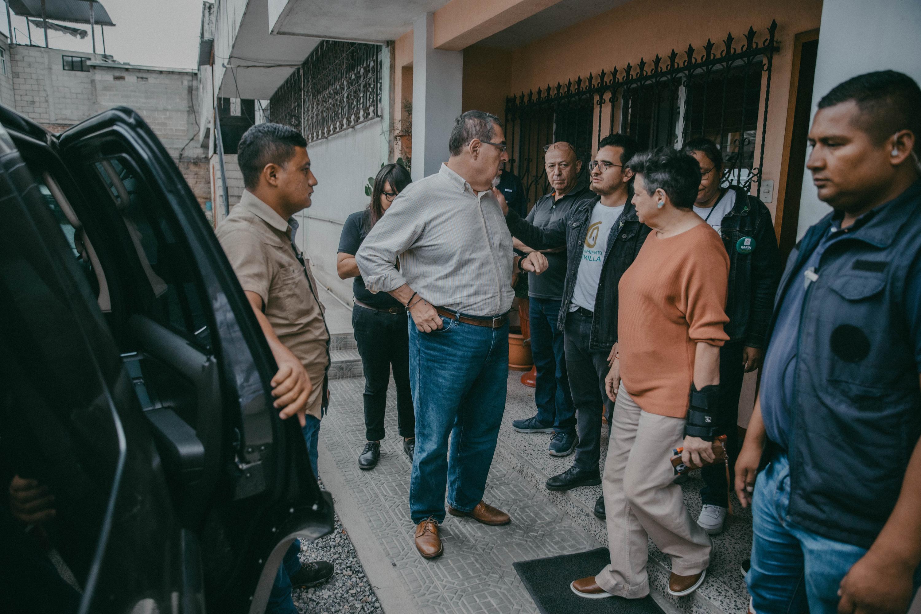 Bernardo Arévalo talks with his campaign manager, political scientist Justo Pérez, after a private conversation with Cardinal Álvaro Ramazzini at the offices of the Huehuetenango Diocese on Friday, August 11. In late July, Ramazzini publicly called for forming a nationwide citizen