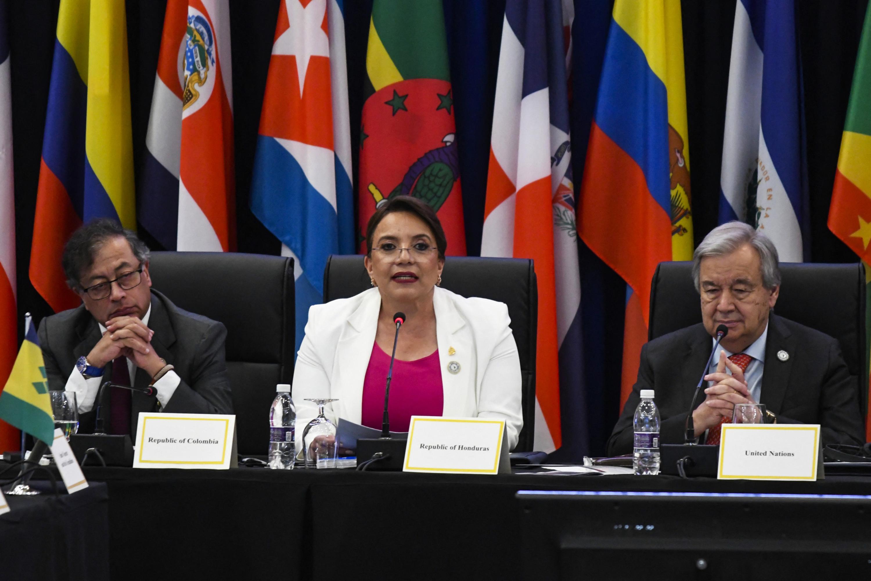 Honduran President Xiomara Castro speaks next to Colombia