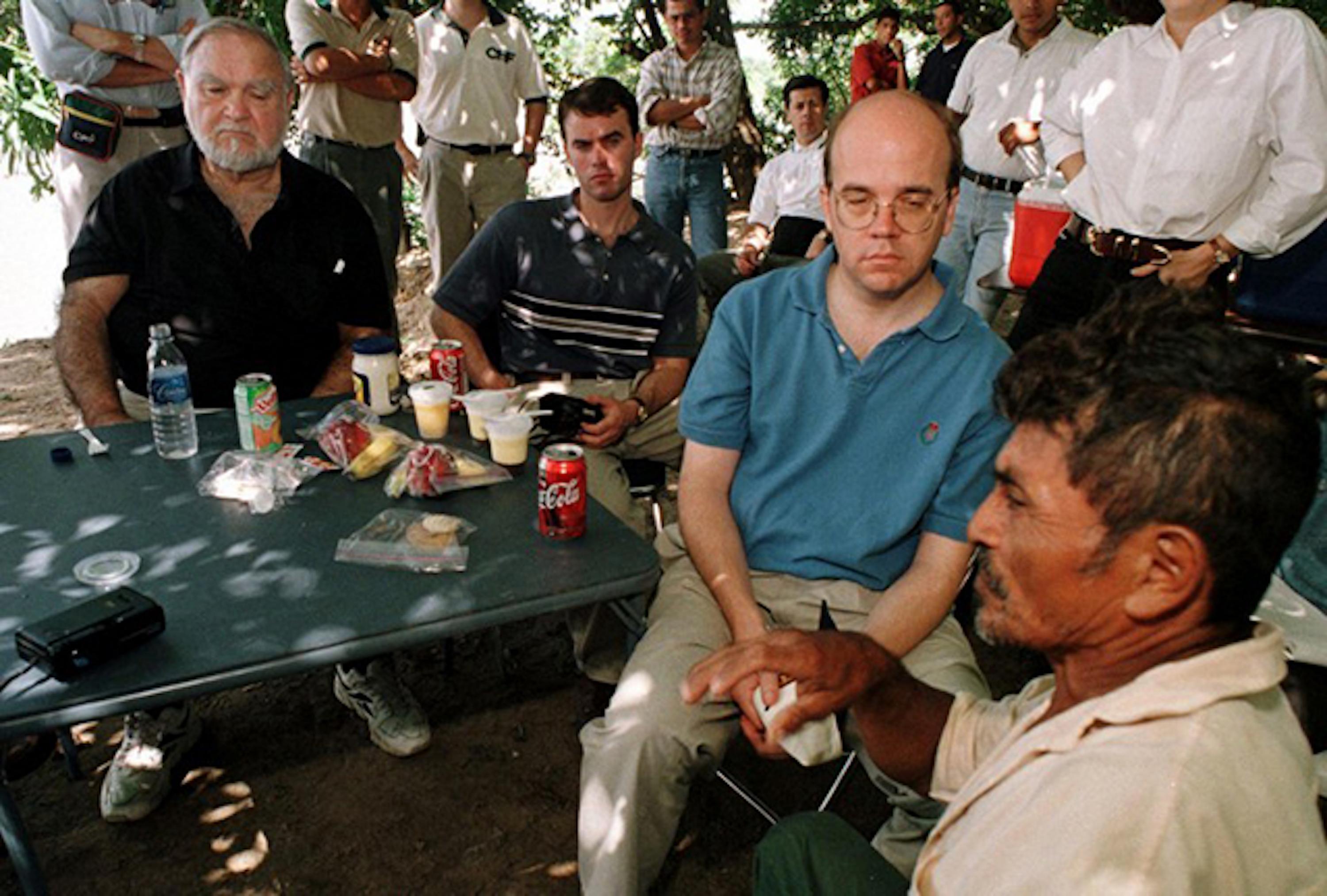 Massachusetts congressmen Joseph Moakley (left) and Jim McGovern (second to the right) during a visit in 2000 to the Bajo Lempa, El Salvador, regarding relief projects set up for communities affected by Hurricane Mitch. Photo Yuri Cortez/AFP