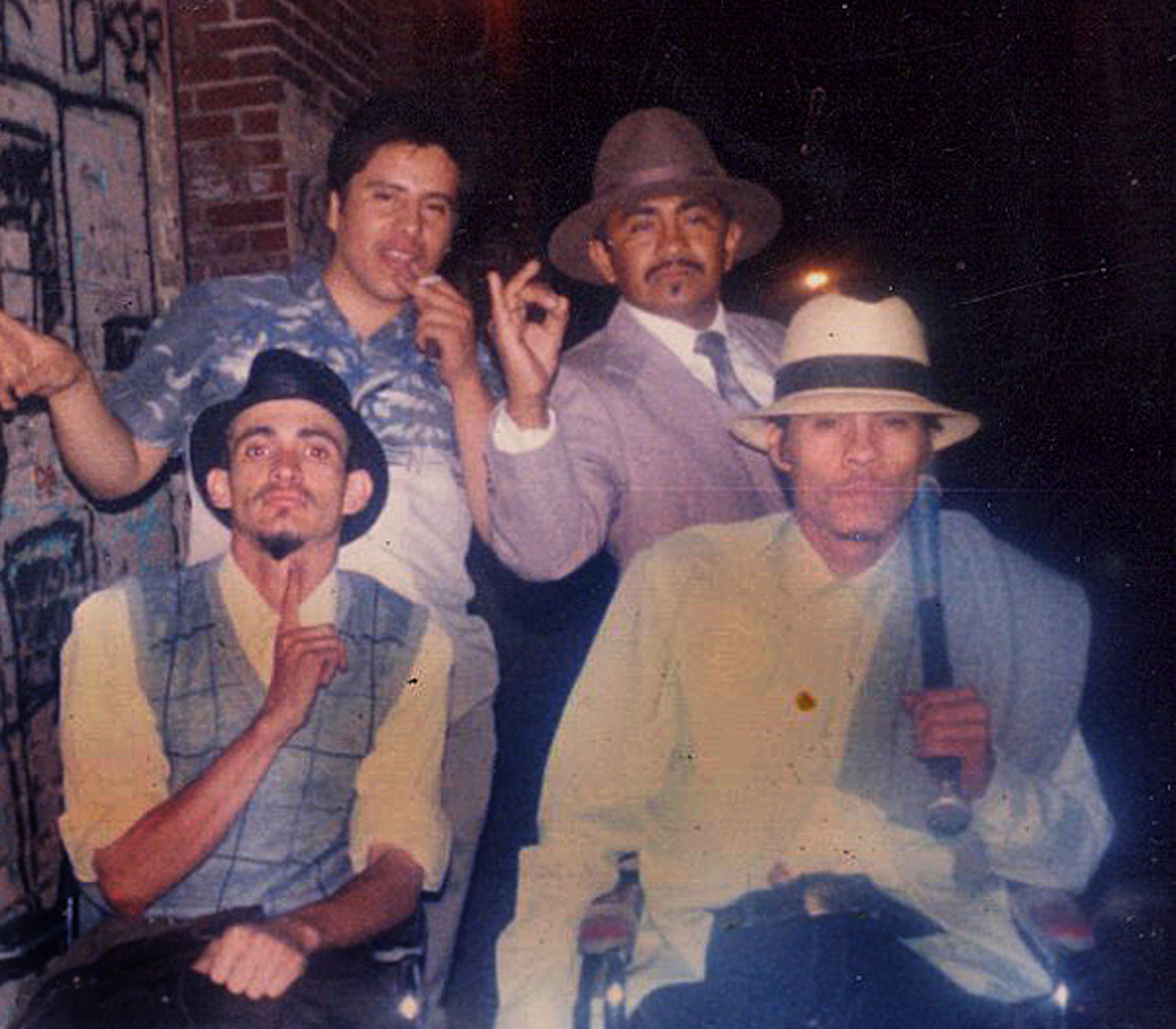 Members of Los Angeles Playboys gang. In the eighties, the oldest southern gangs sported “pachuco” style at parties. On the bottom right is El Flaco, an elder palabrero of the Normandie Locos clique.