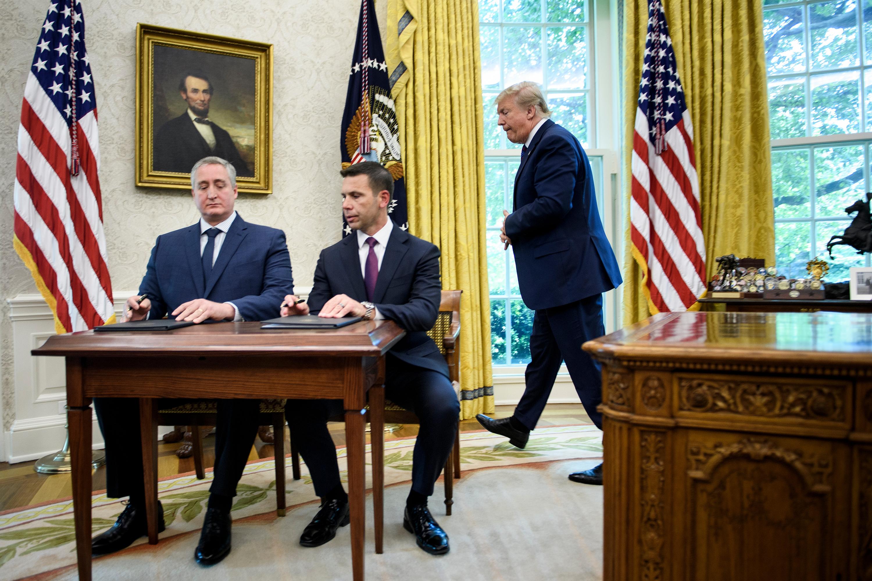 US President Donald Trump walks to watch as Guatemala