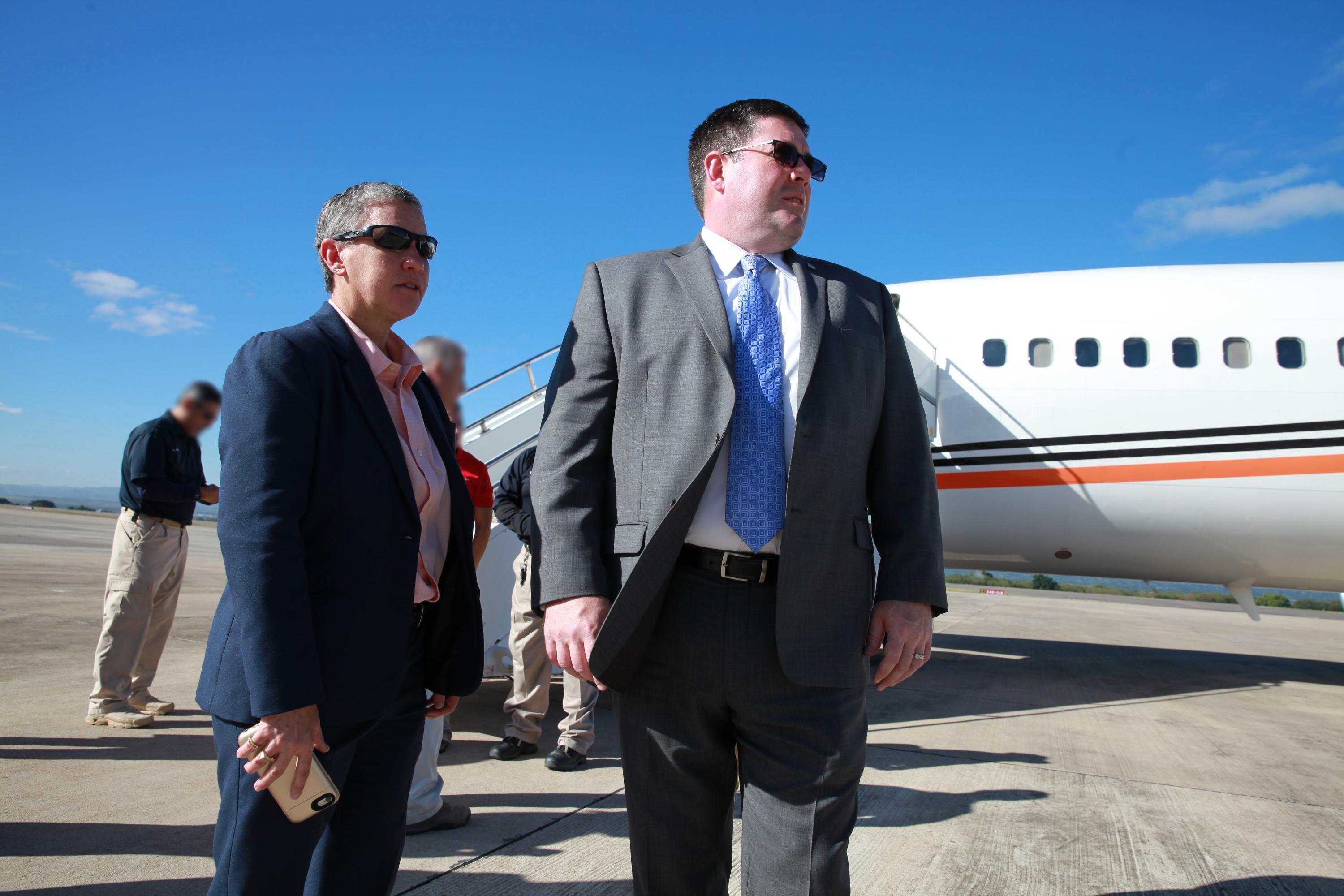 U.S. Immigration and Customs Enforcement (ICE) Enforcement and Removal Operations (ERO) Deputy Executive Associate Director Philip Miller (right) on the tarmac with an ICE removal flight in Honduras. Photo: ICE.