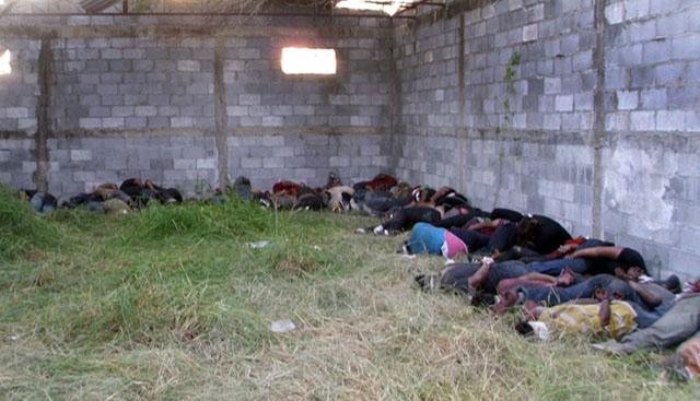 GRAPHIC CONTENT (FILES) The bodies of some of the 72 migrants killed in a ranch in Mexico, lie on the ground at an abandoned warehouse in San Fernando, Tamaulipas state, Mexico, on August 25, 2010. Ecuador