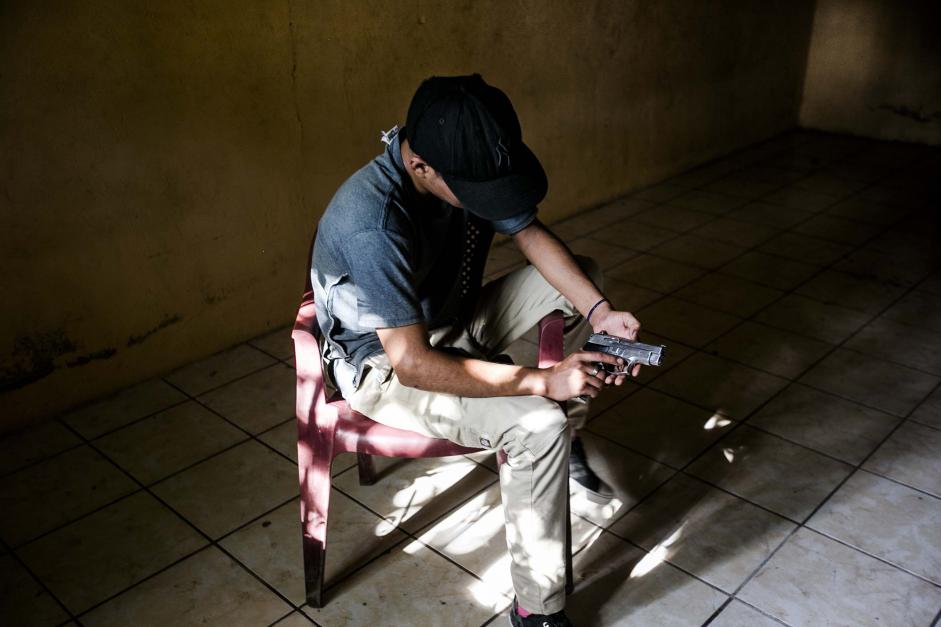 A 15-year-old gang member with a gun in a house in La Paz in July.