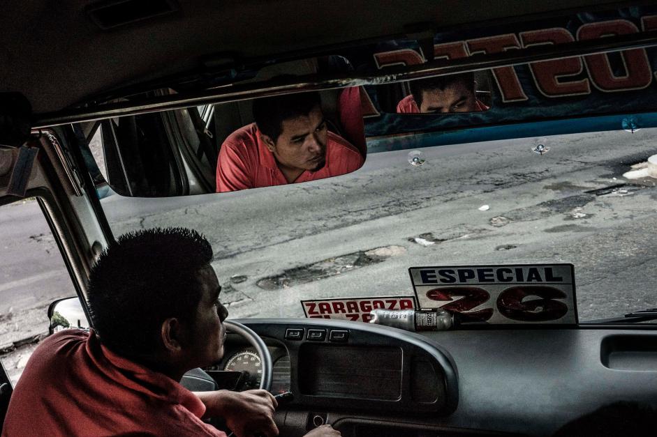 A bus driver in San Salvador in June. Fred Ramos/El Faro for The New York Times